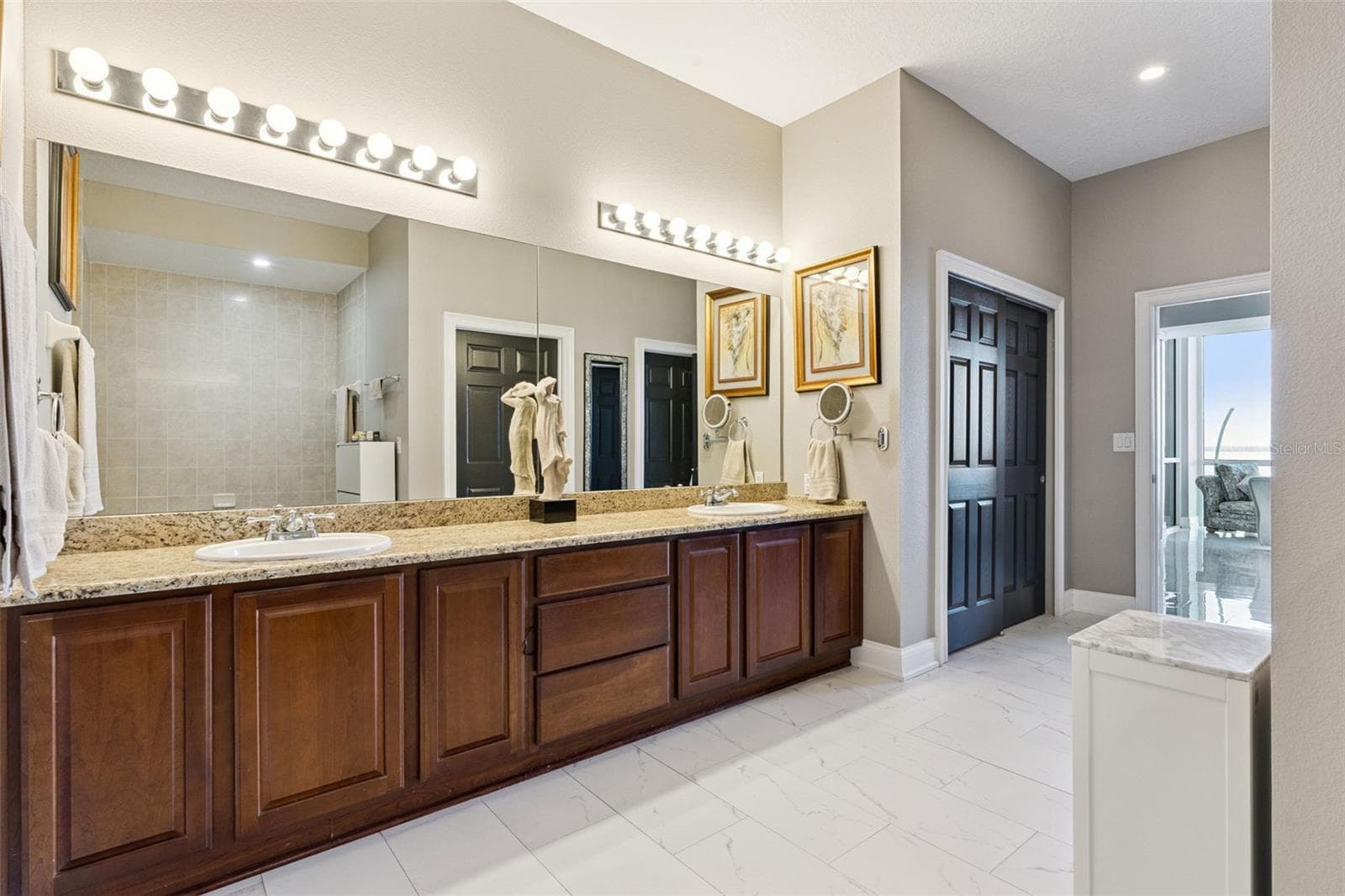 Primary bathroom with double sinks. - 225 W SEMINOLE BLVD #603, SANFORD