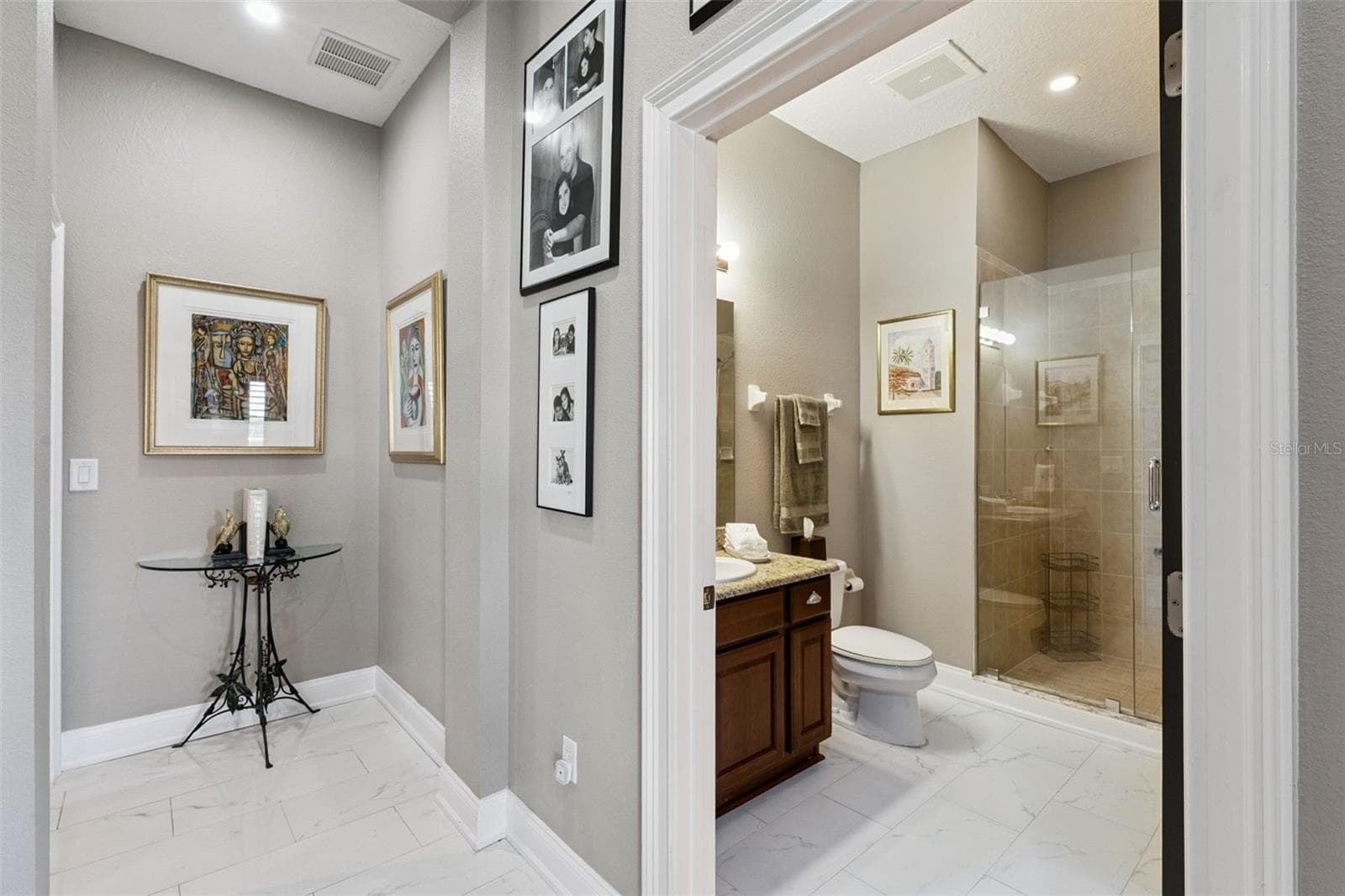 Hallway bathroom with updated seamless glass shower. - 225 W SEMINOLE BLVD #603, SANFORD