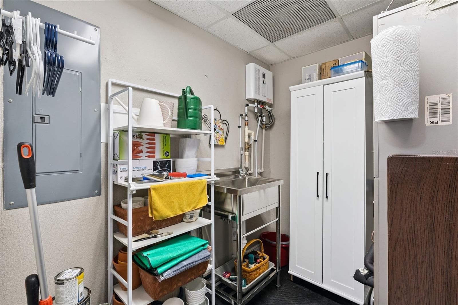 Utility closet with sink and storage. - 225 W SEMINOLE BLVD #603, SANFORD