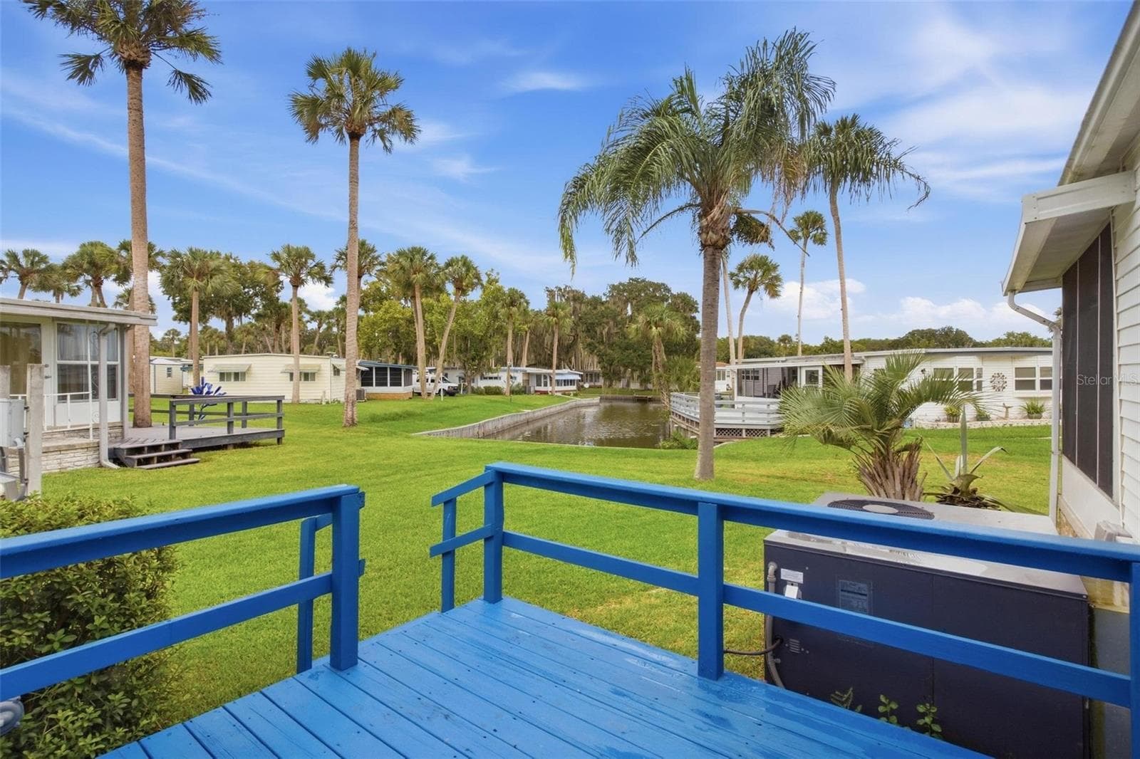 Canal view from open deck - 33 COCOS PLUMOSA DR, EUSTIS