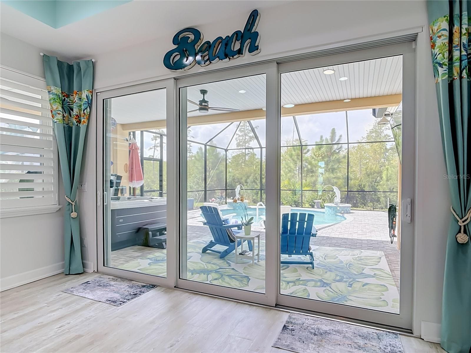 View of Pool from Living Room - 213 BLUE STARFISH PL, DAYTONA BEACH