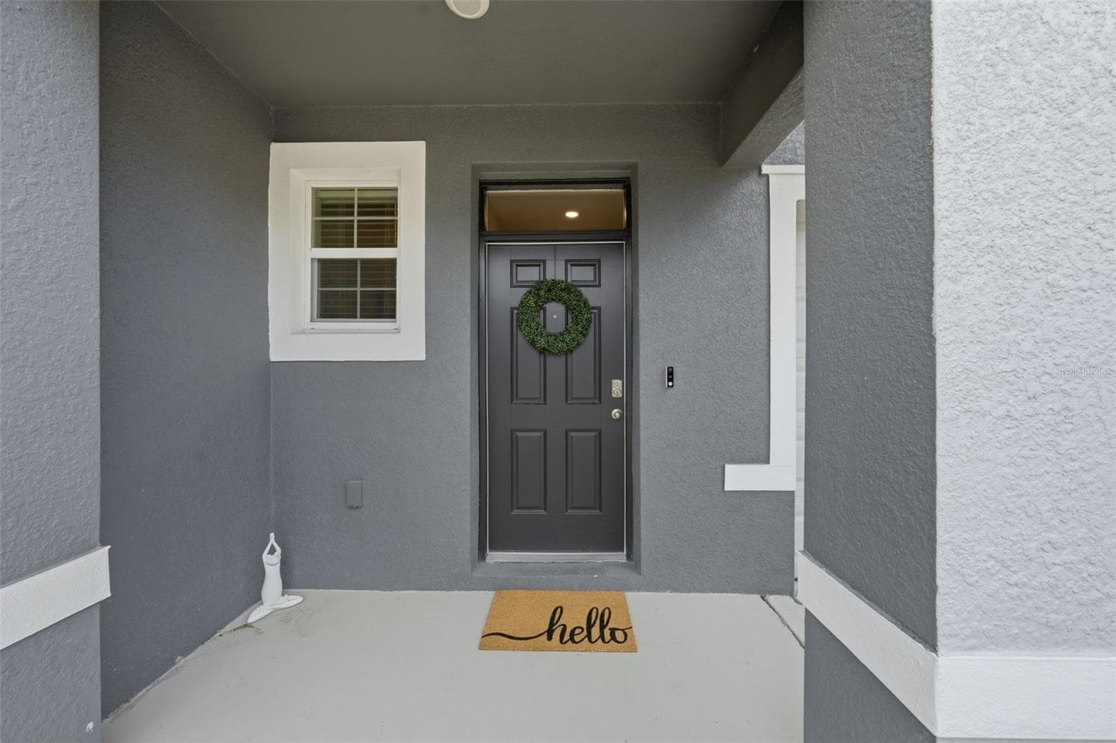 Veranda offers a beautiful entrance! - 5238 DRAGONFLY DR, WILDWOOD