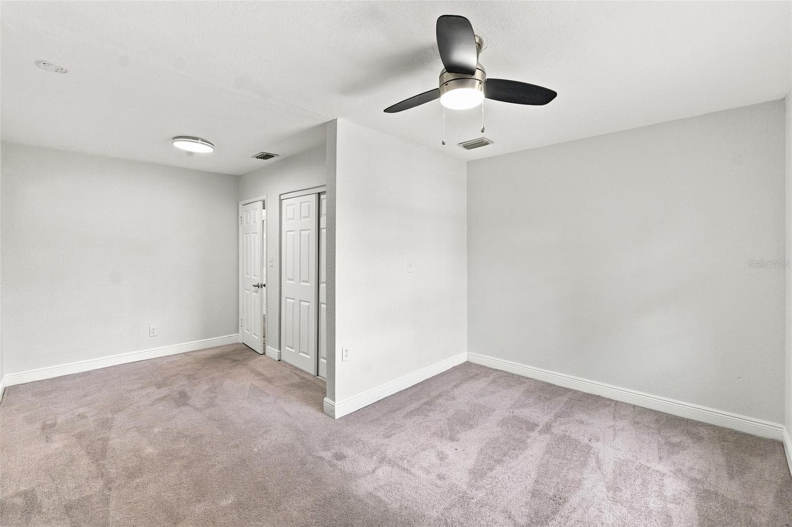 Primary Bedroom with Natural Light - 8326 ENDIVE AVE, TAMPA