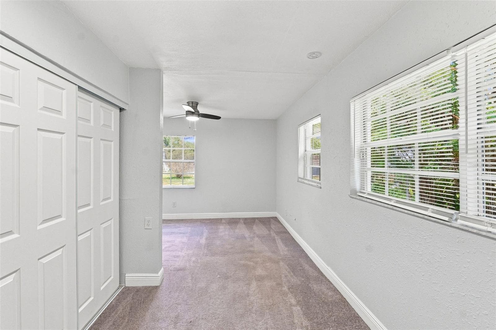 Primary Bedroom with Natural Light - 8326 ENDIVE AVE, TAMPA