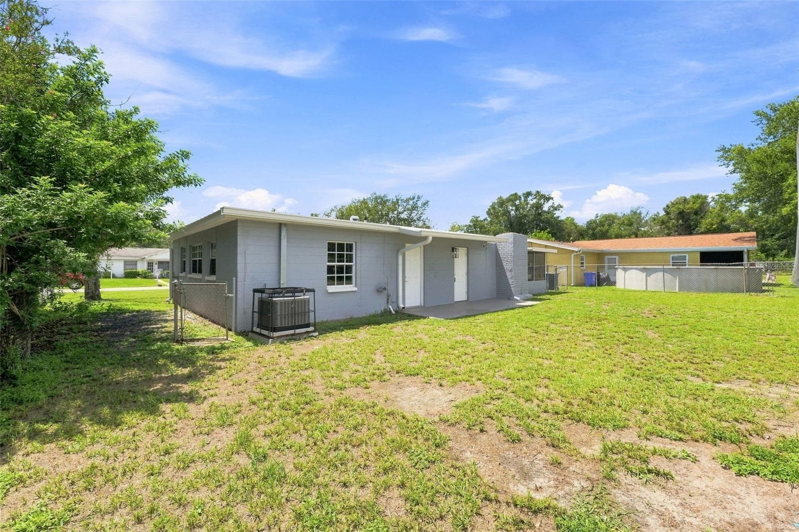 Generously sized, fully fenced backyard perfect for privacy and outdoor activities. - 8326 ENDIVE AVE, TAMPA