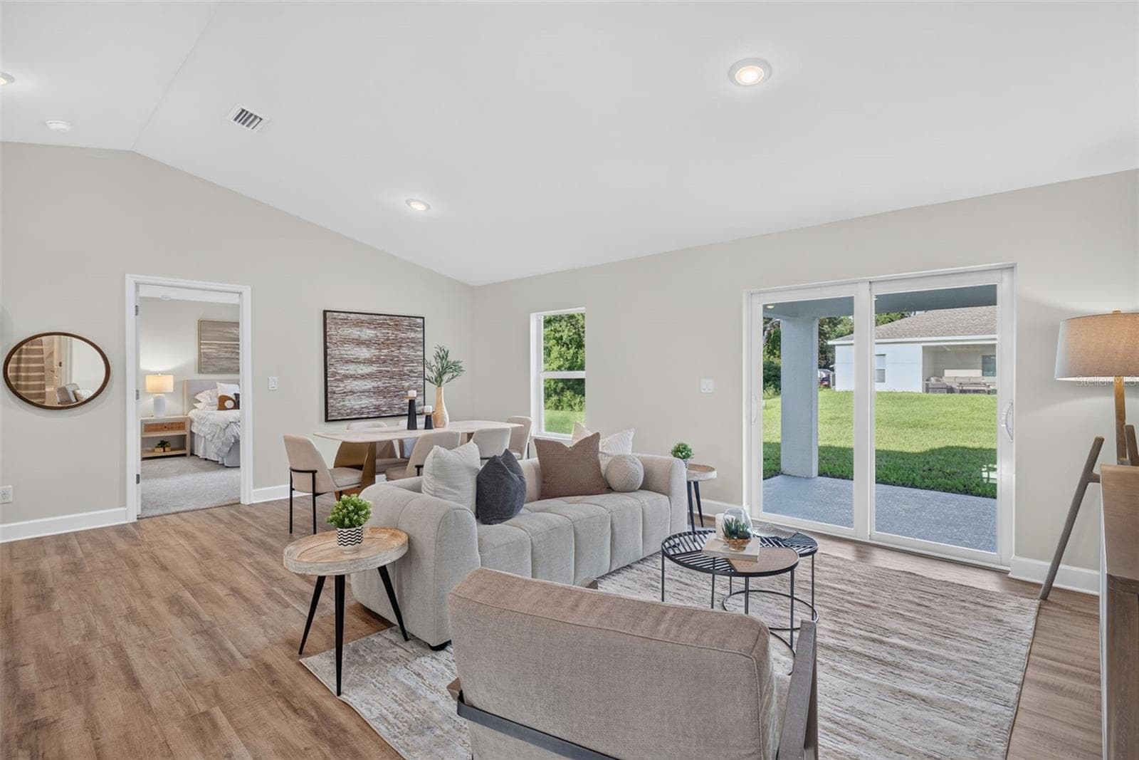 Staged Livingroom/diningroom with Luxury Vinyl Floors - 315 LINDON ST, PORT CHARLOTTE