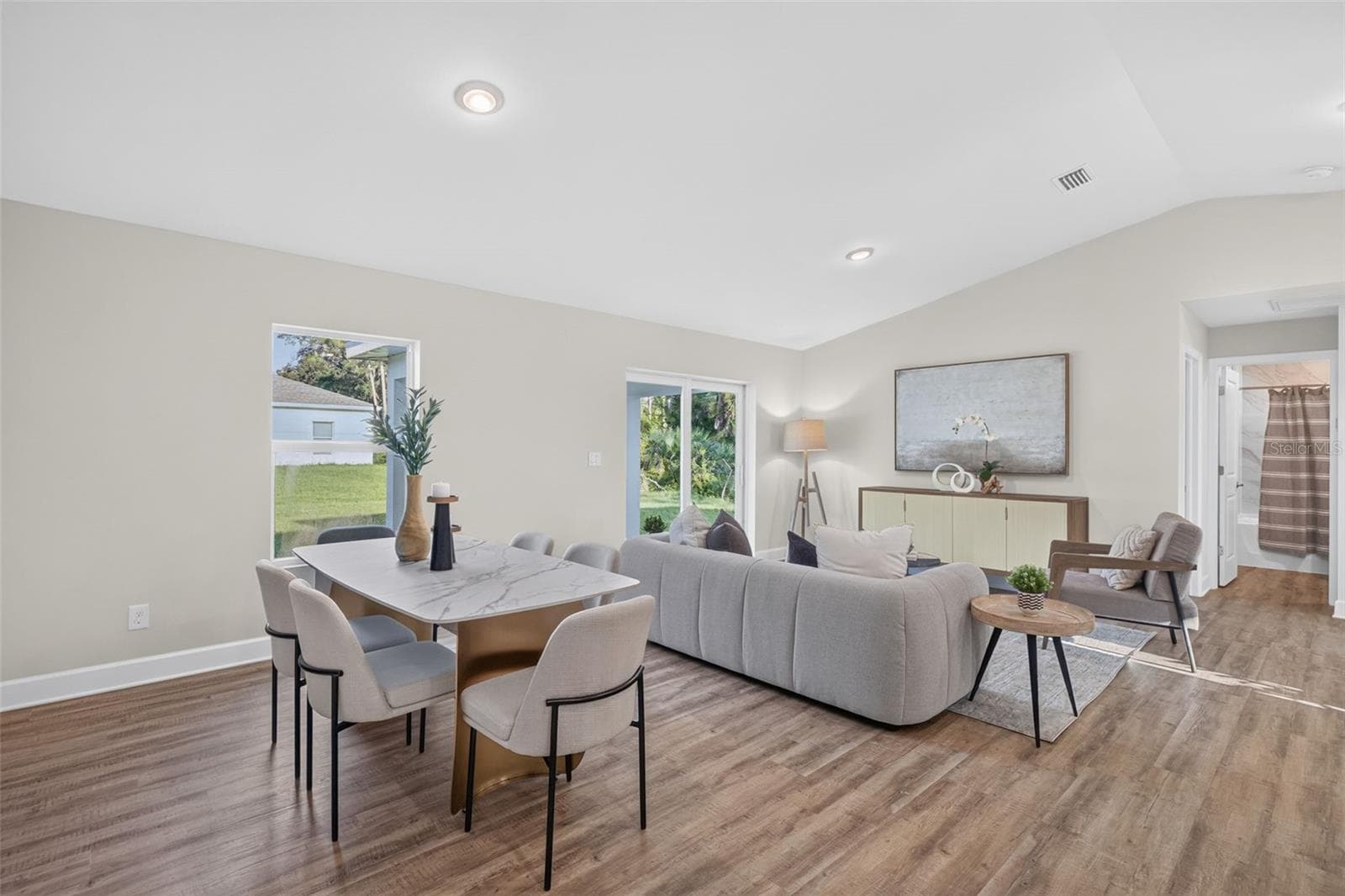Staged dining area and living room view - 315 LINDON ST, PORT CHARLOTTE