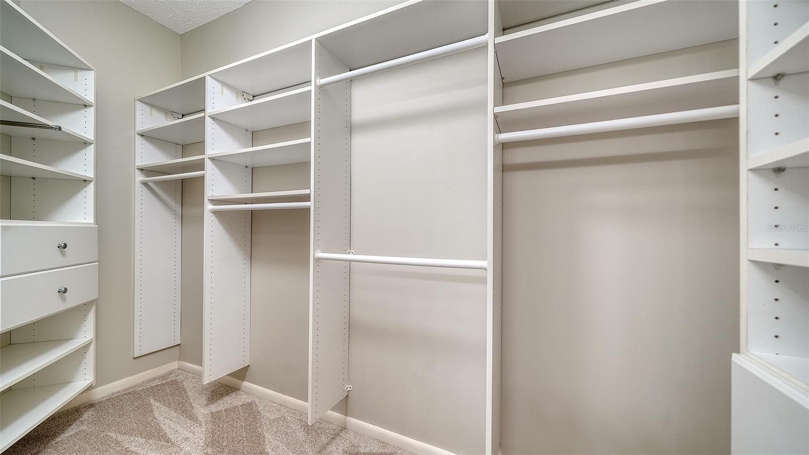 custom closet with new carpeting - 1638 STARLING DR #105, SARASOTA