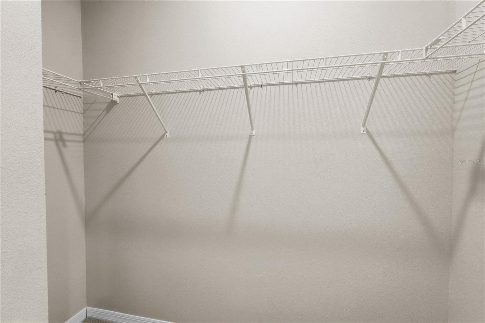 Primary walk-in closet - 5740 WOODLAND SAGE DR, SARASOTA