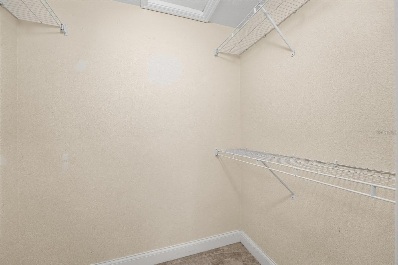 Primary walk-in closet - 2580 VOGLER LN, NORTH PORT
