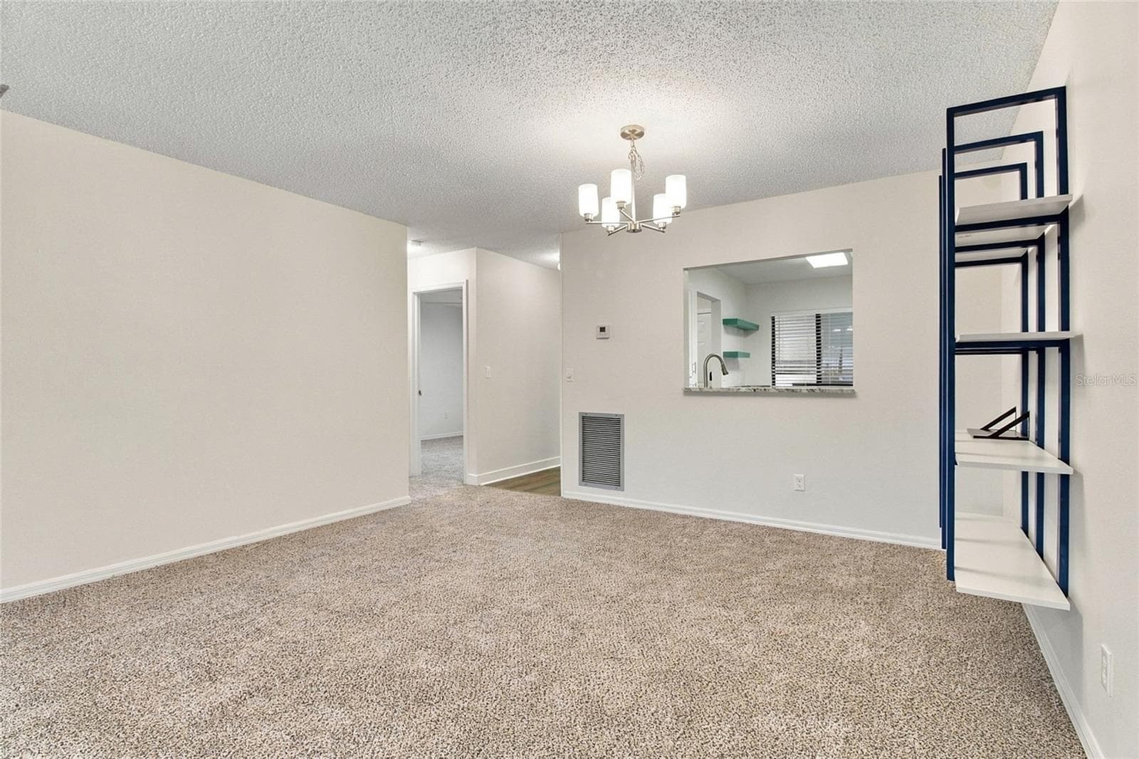 Dining Area + Corridor to Bedroom 2 and Shared Bathroom - 721 83RD AVE N #202, ST PETERSBURG