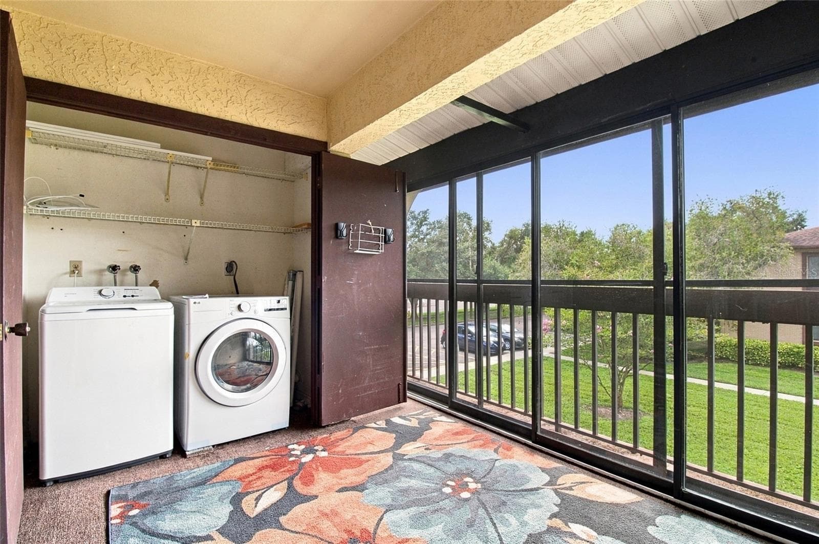 Enclosed Balcony with Laundry Closet. - 721 83RD AVE N #202, ST PETERSBURG