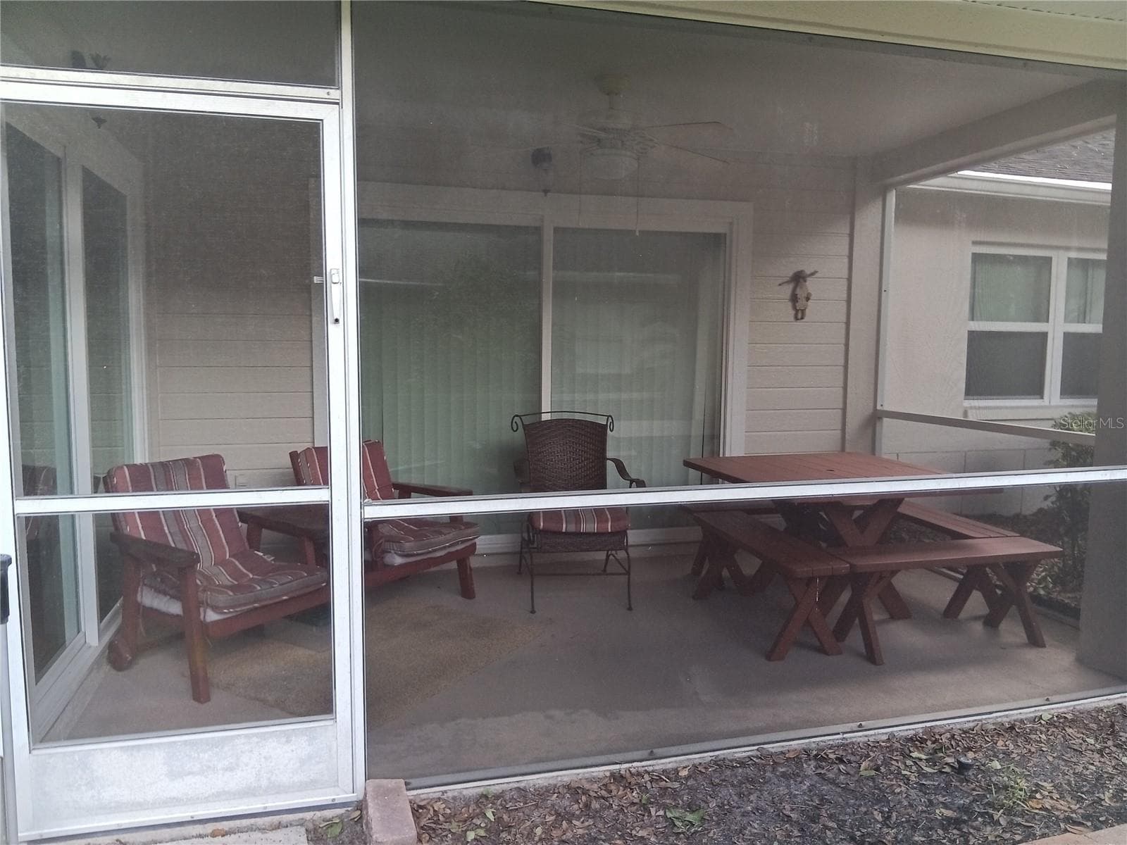 Screened porch ready for lunch or dinner fron of your garden - 5316 LOCHMEAD TER, ZEPHYRHILLS