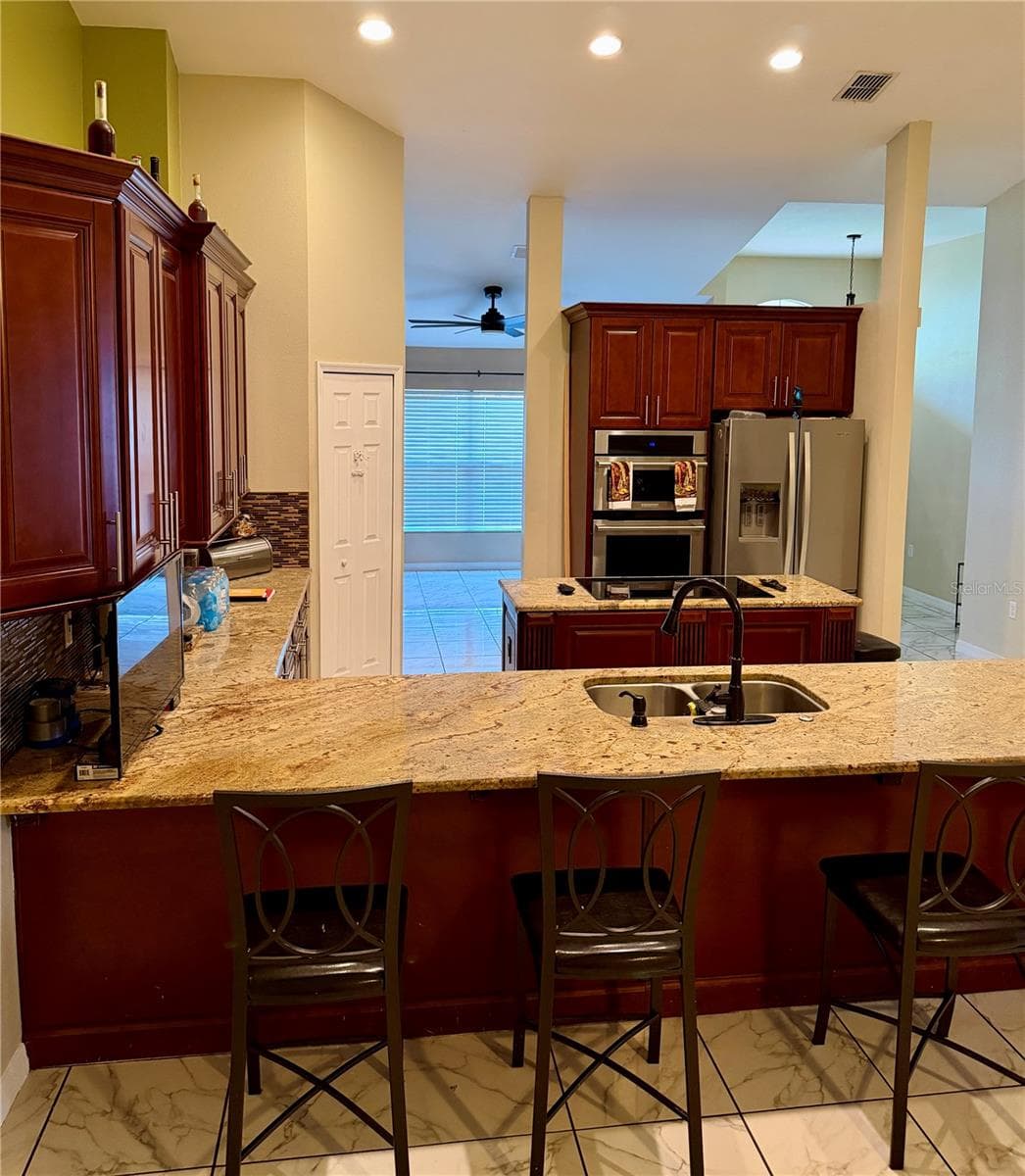 Kitchen View / Breakfast Bar - 319 MARQUEE DR, KISSIMMEE