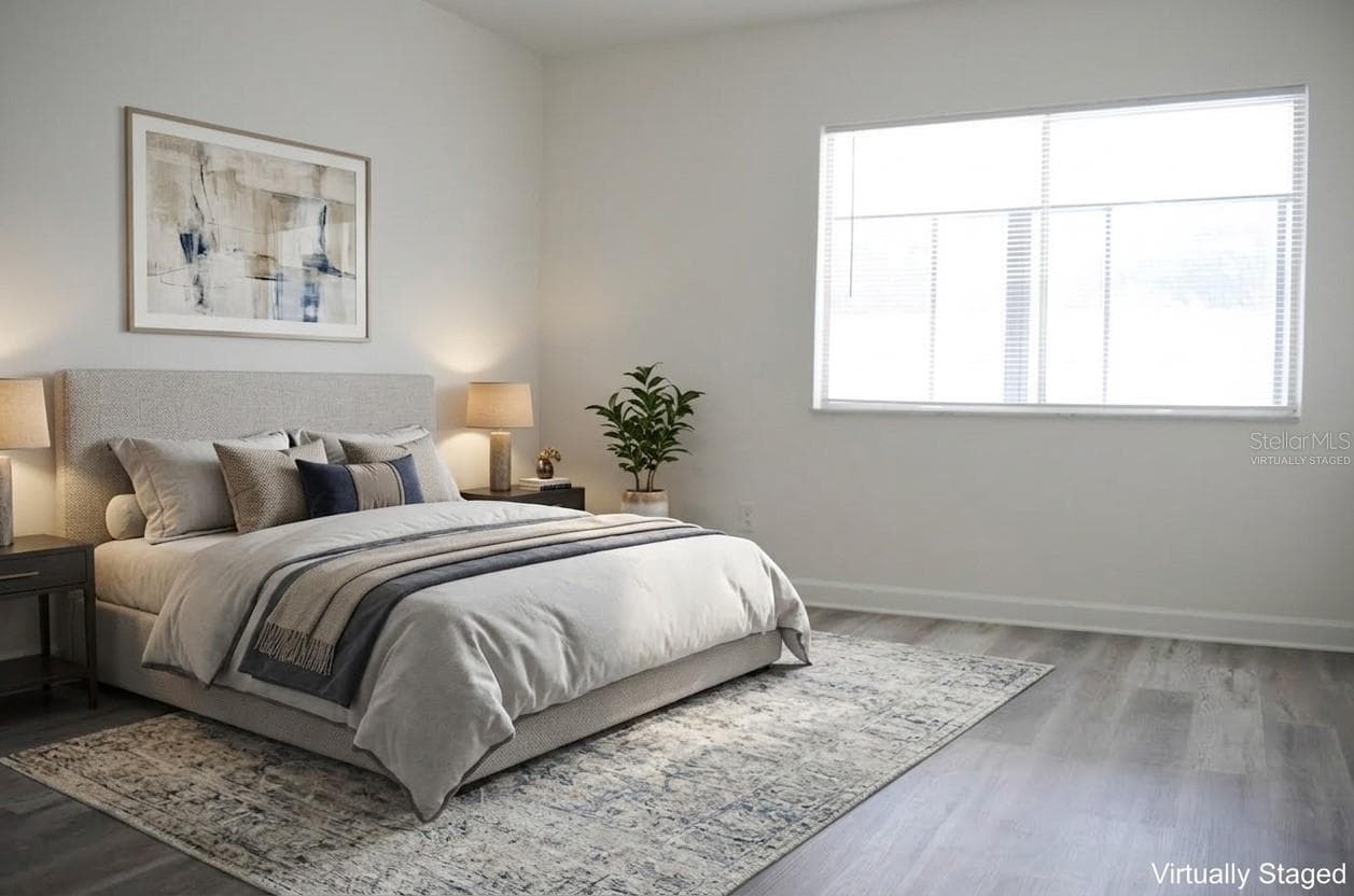 virtually staged primary bedroom - 4435 1ST ST NE #111, ST PETERSBURG