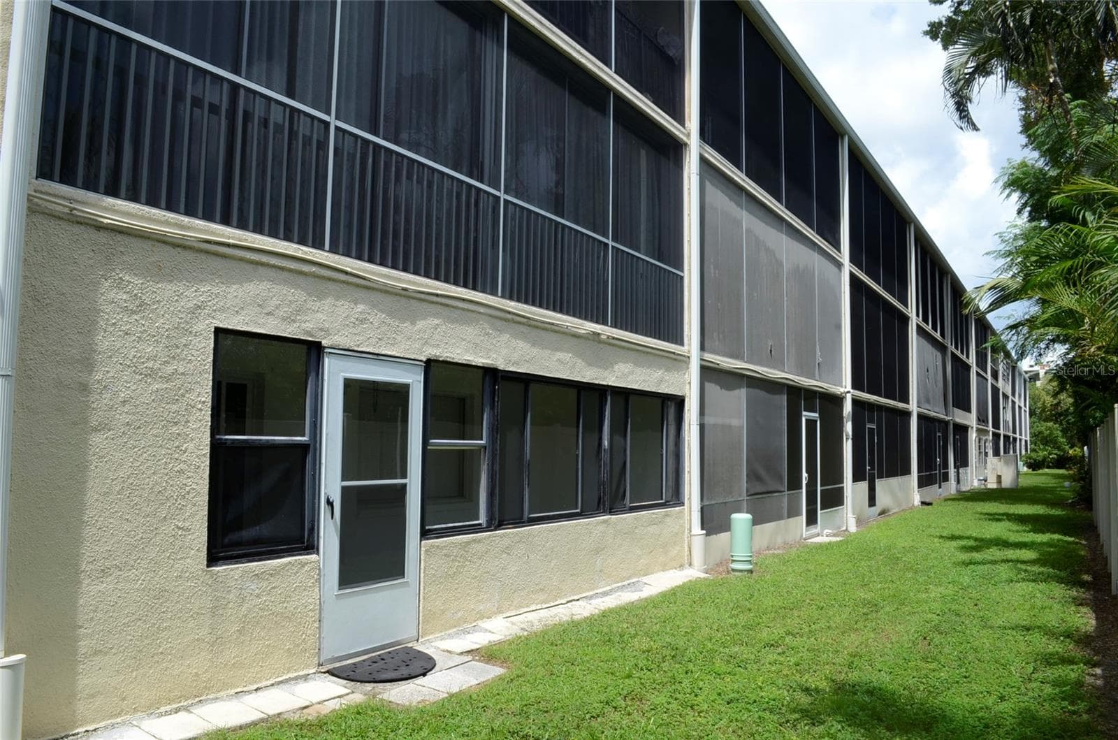 back of the building view-porch of unit 111 - 4435 1ST ST NE #111, ST PETERSBURG