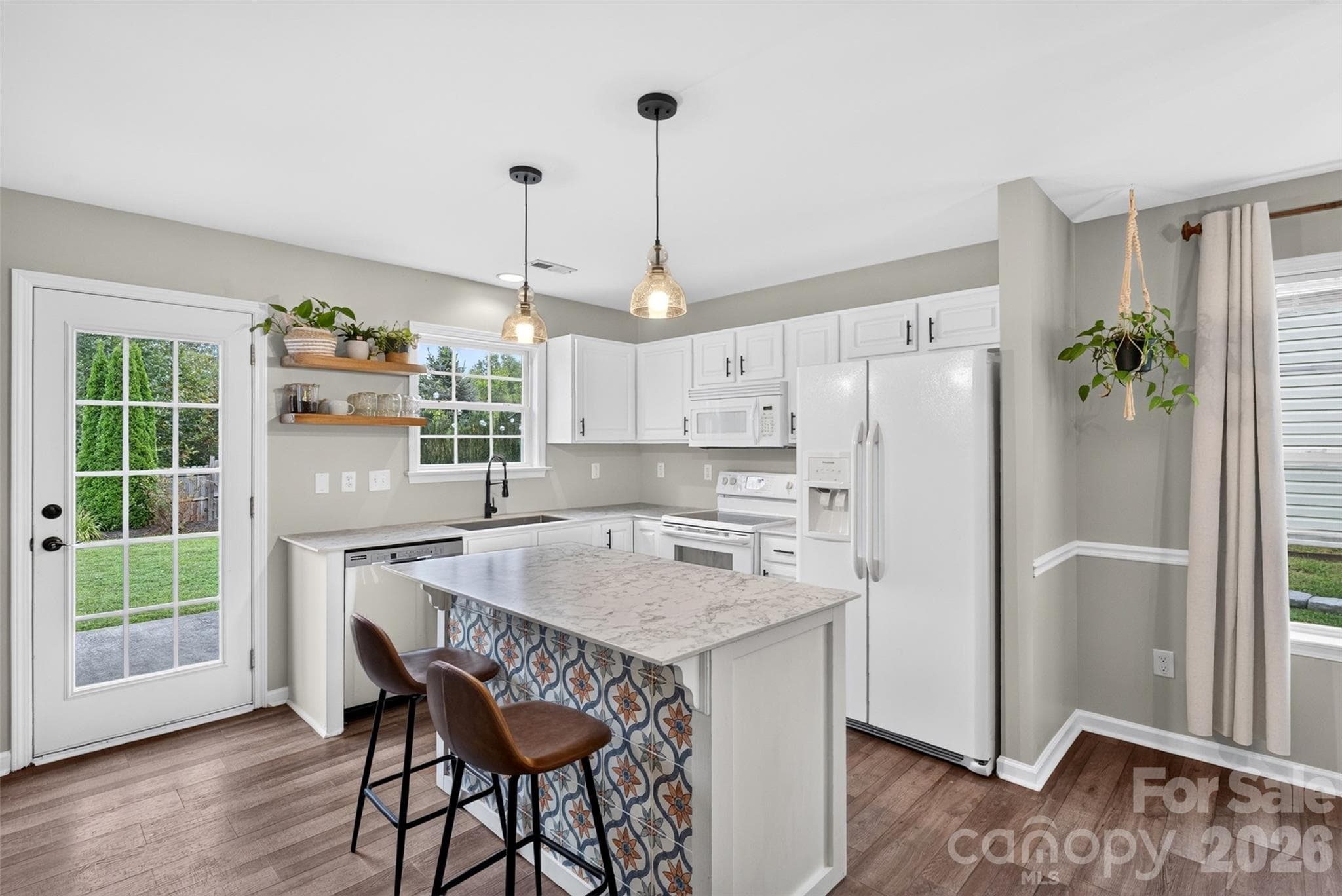 Great updated kitchen area!!! Love the tiles on the island! - 105 Creekwalk Lane, Hendersonville