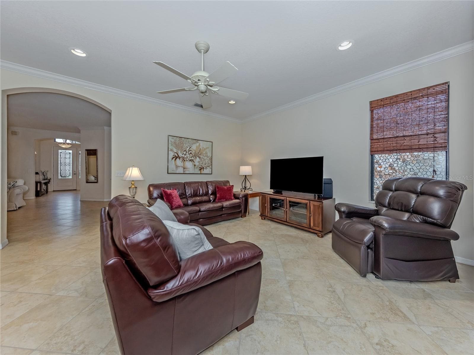Family Room with Crown Molding and Tile on the diagonal flooring - 20702 CAPELLO DR, VENICE