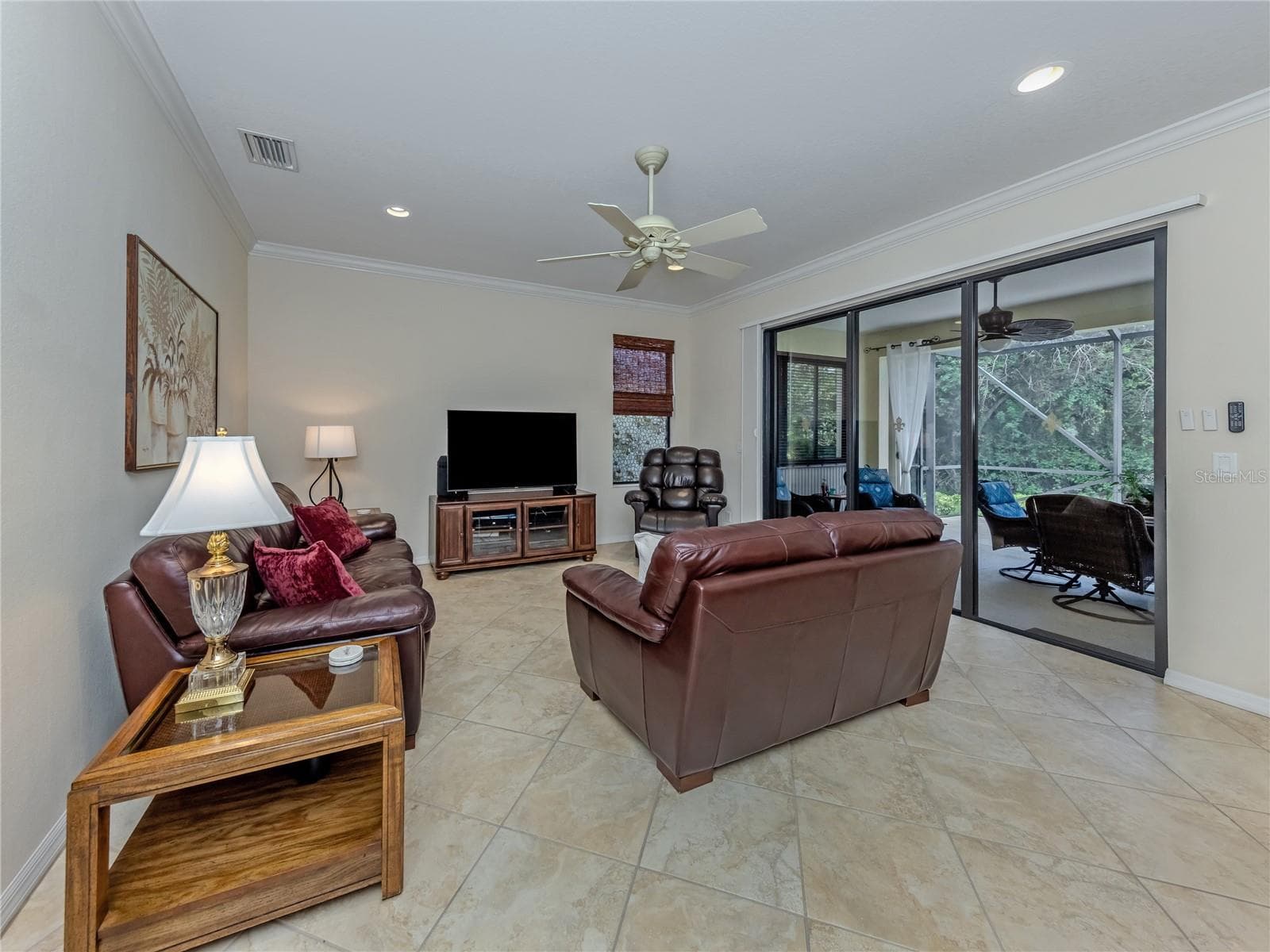 Family Room, with sliders leading to an extended lanai - 20702 CAPELLO DR, VENICE