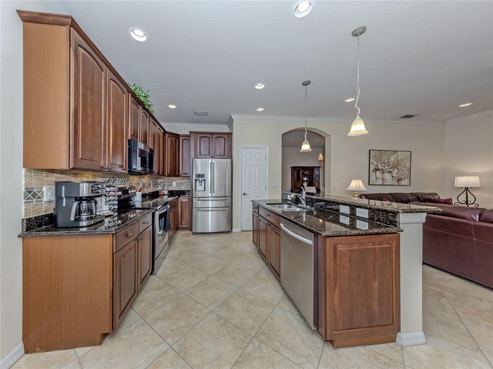 Kitchen with backsplash - 20702 CAPELLO DR, VENICE