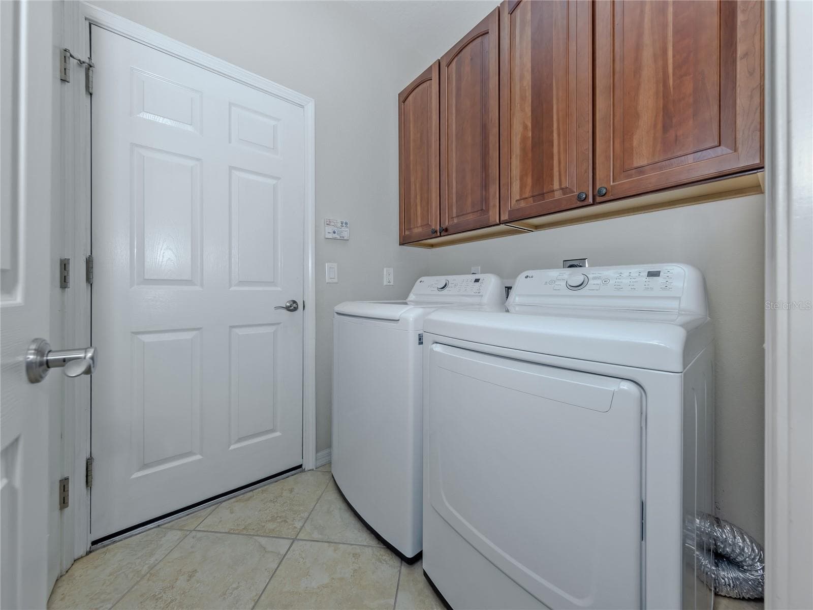 Laundry with storage cabinets - 20702 CAPELLO DR, VENICE