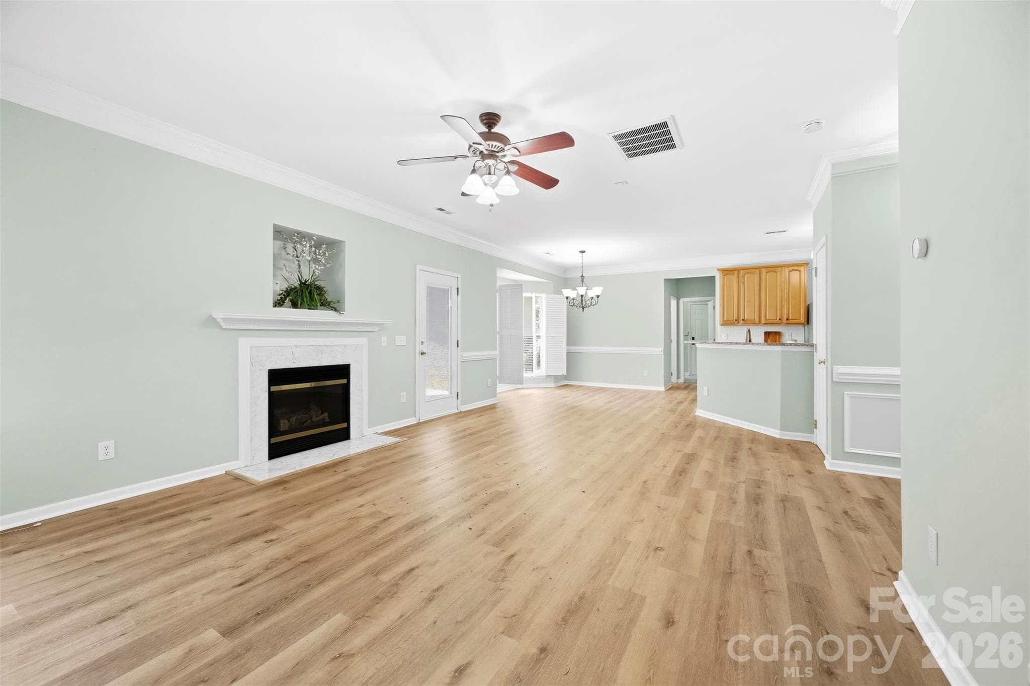 Living room view to breakfast room and kitchen - 8709 Ellington Park Drive, Charlotte