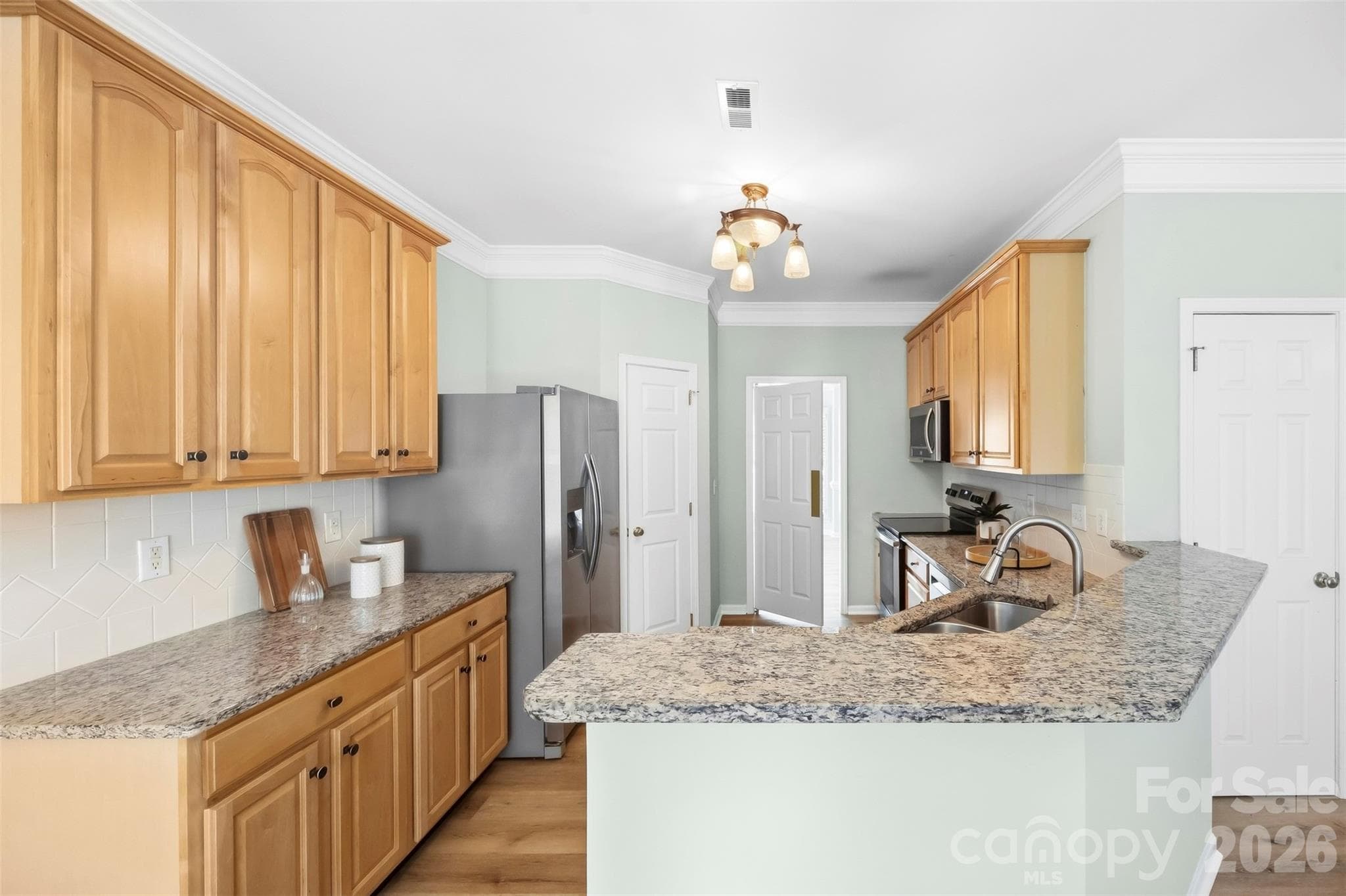 Kitchen with large granite bar - 8709 Ellington Park Drive, Charlotte