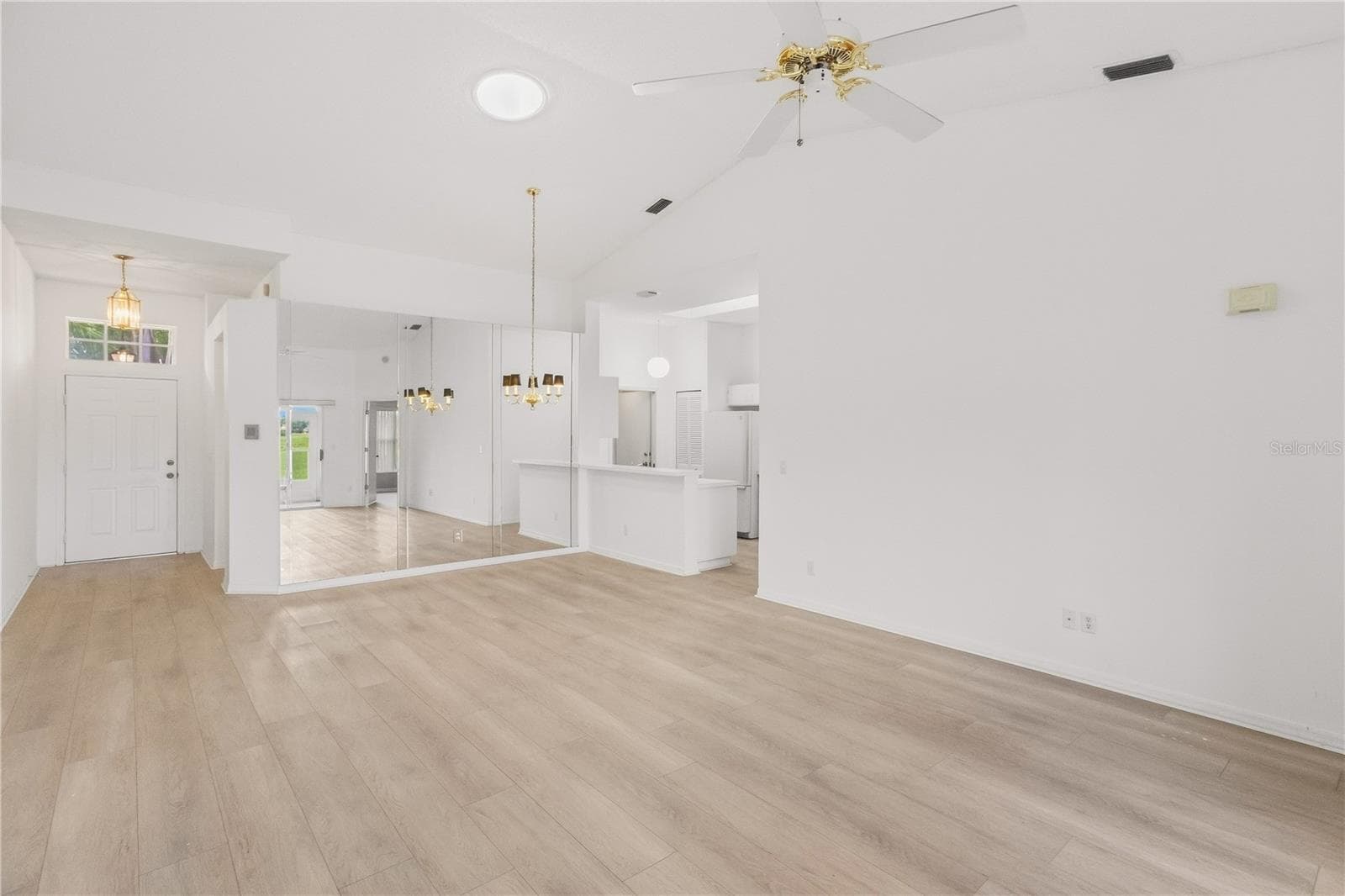 Open and inviting space with a seamless flow between the dining and living areas - 1002 NICENE CT #47, SUN CITY CENTER