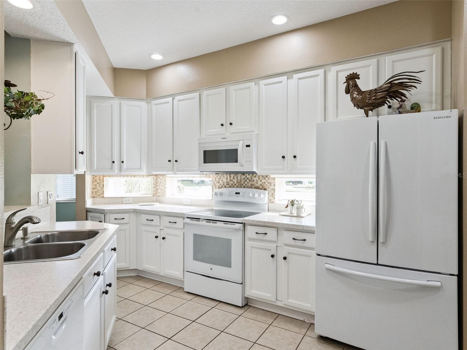 The Kitchen has ample 42" cabinets with pullouts on the bottom and stone counters. - 5401 ESSEX CT, LEESBURG
