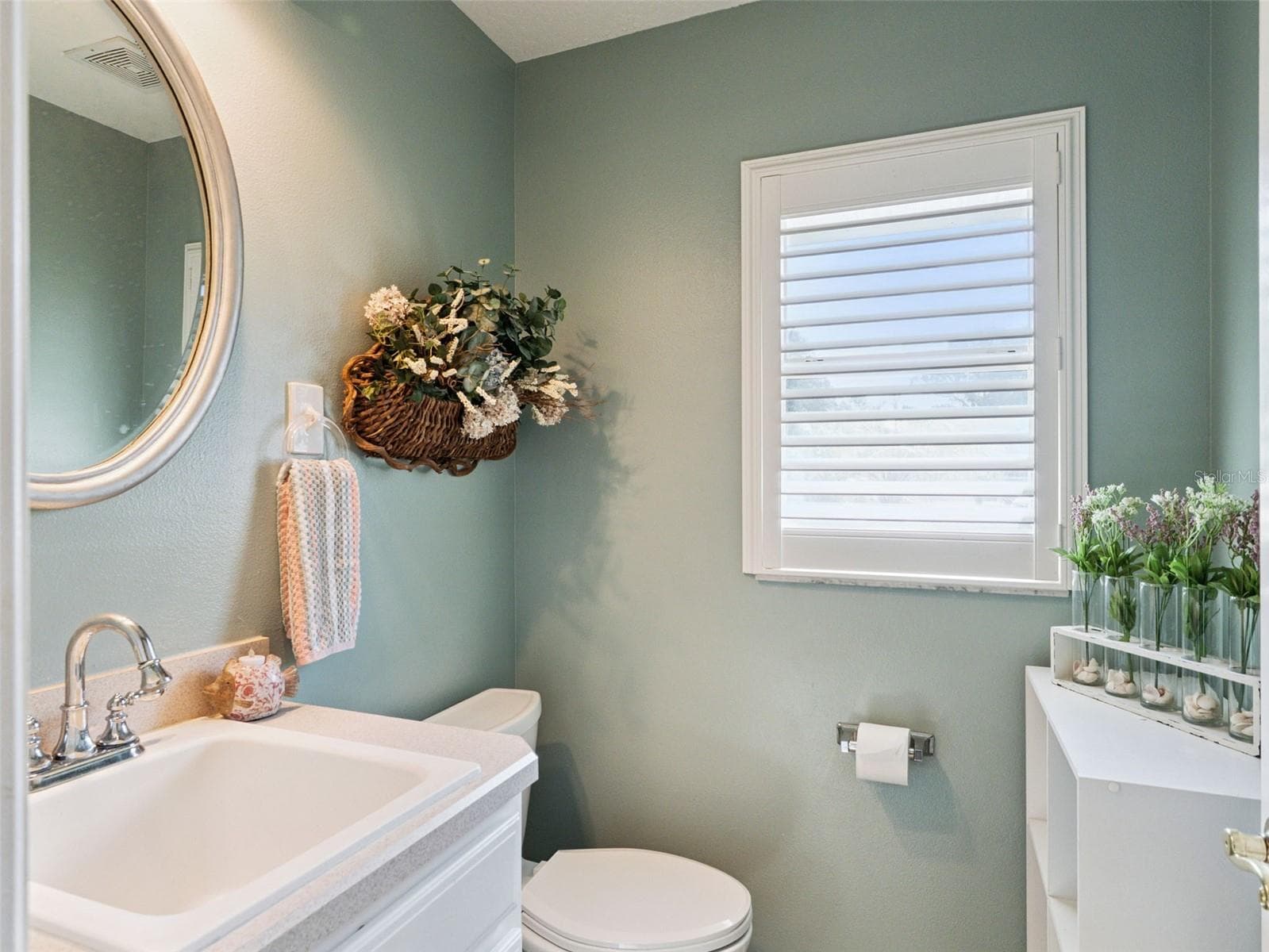 This convenient Powder Room is just off the Laundry/Mud Room for easy access from outside the house. - 5401 ESSEX CT, LEESBURG