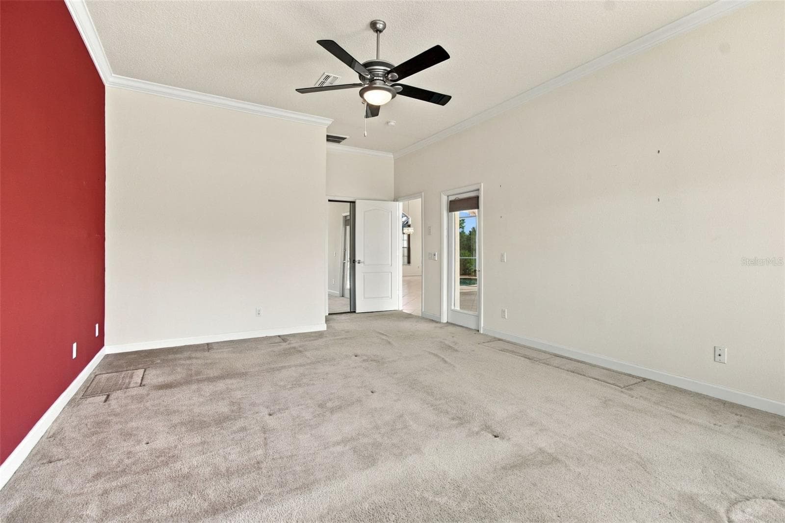 Your expansive primary bedroom offers easy access to your hot tub, pool, screened lanai and oversized conservation pond lot. - 1301 FOX CHAPEL DR, LUTZ
