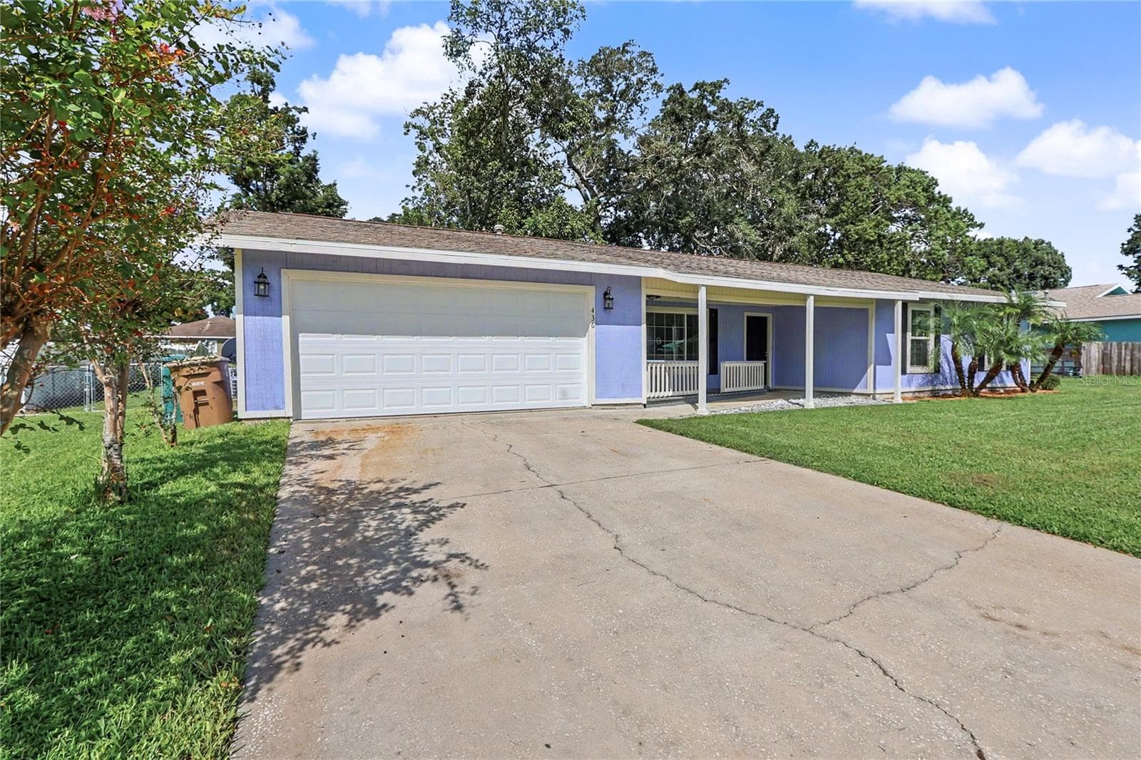 Garage and driveway - 436 NE 47TH CT, OCALA