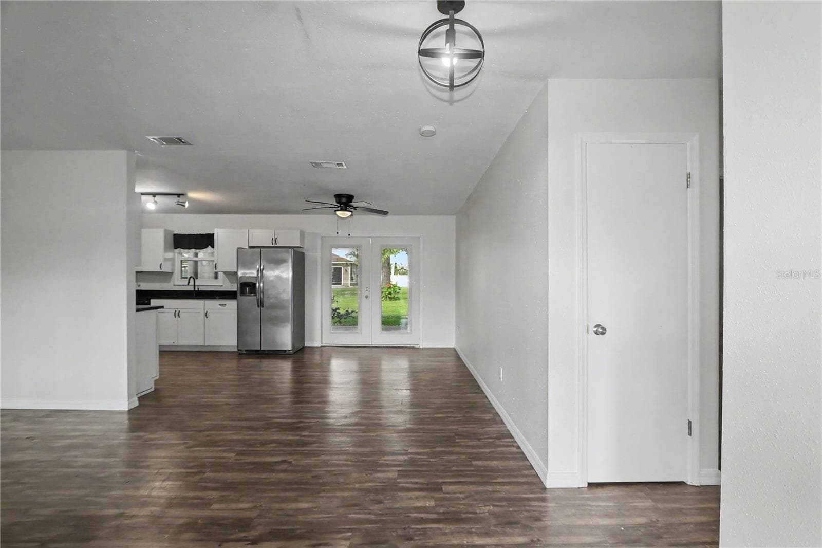 Living room/Dining area and kitchen - 436 NE 47TH CT, OCALA