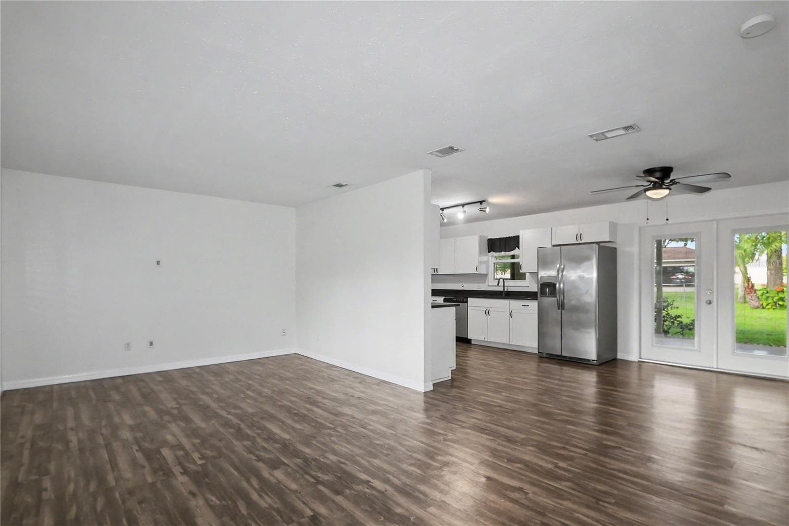 Living room/Dining area and kitchen - 436 NE 47TH CT, OCALA