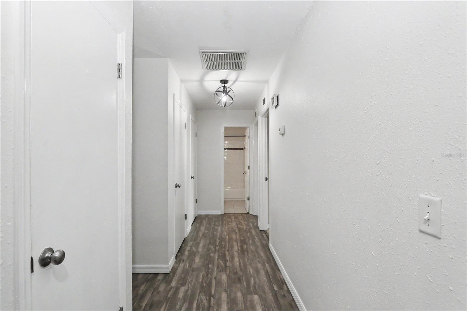 Hallway to bedrooms - 436 NE 47TH CT, OCALA