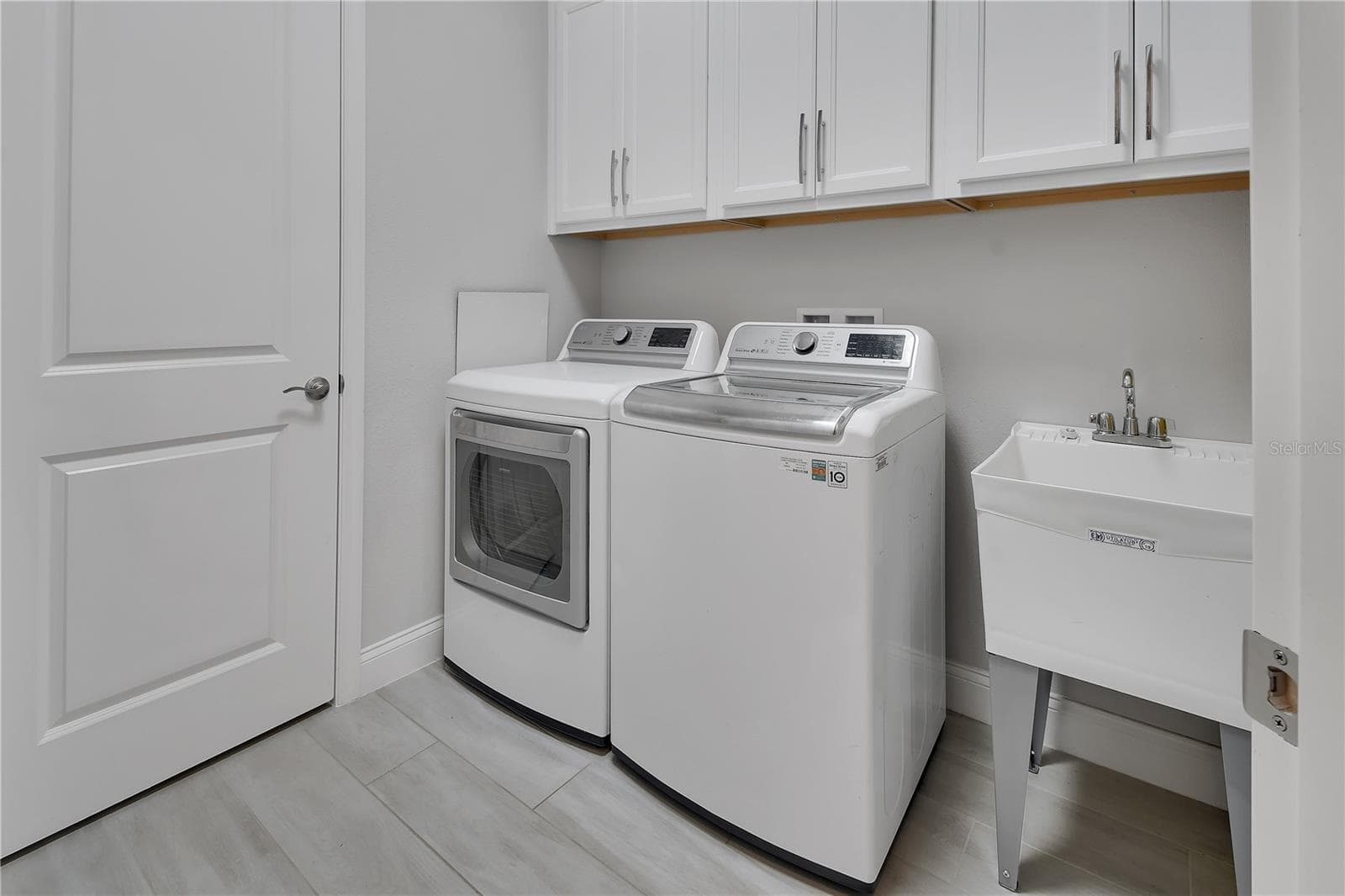 Laundry room with secondary pantry/closet - 1011 MEGANO BLVD, DELAND