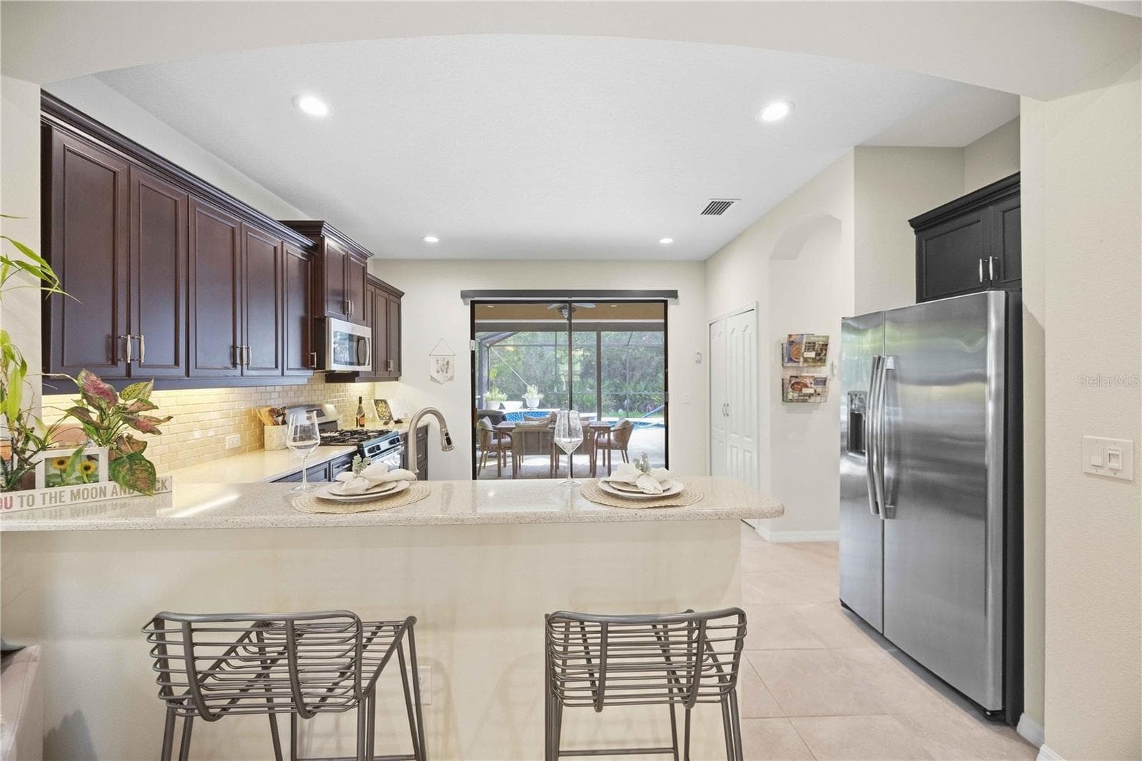 Kitchen overlooking lanai and pool - 216 MARCHENO WAY, NORTH VENICE