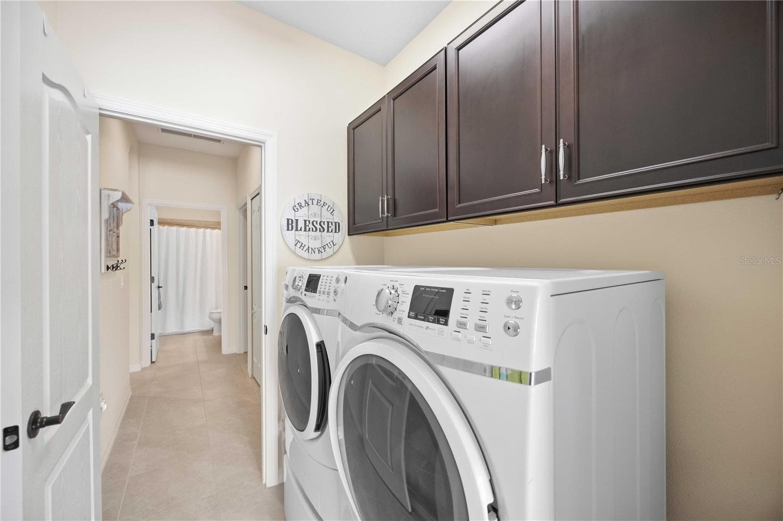 Laundry room with cabinets - 216 MARCHENO WAY, NORTH VENICE