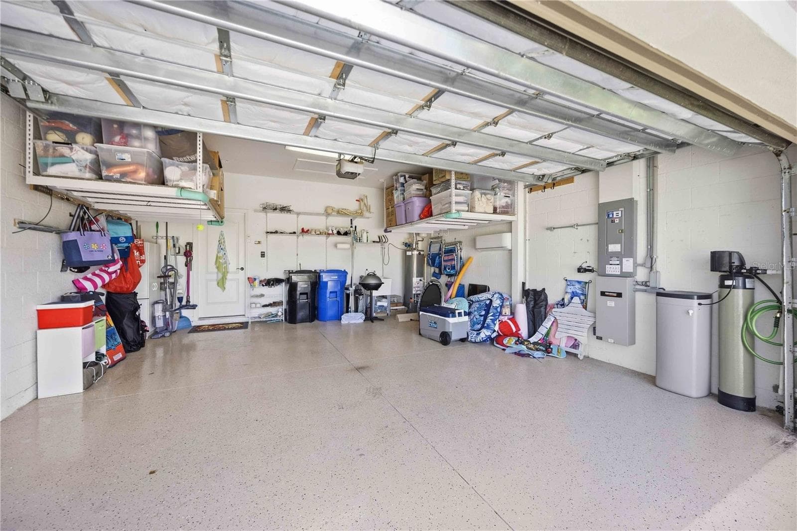 Garage with storage and mini split A/C unit - 216 MARCHENO WAY, NORTH VENICE