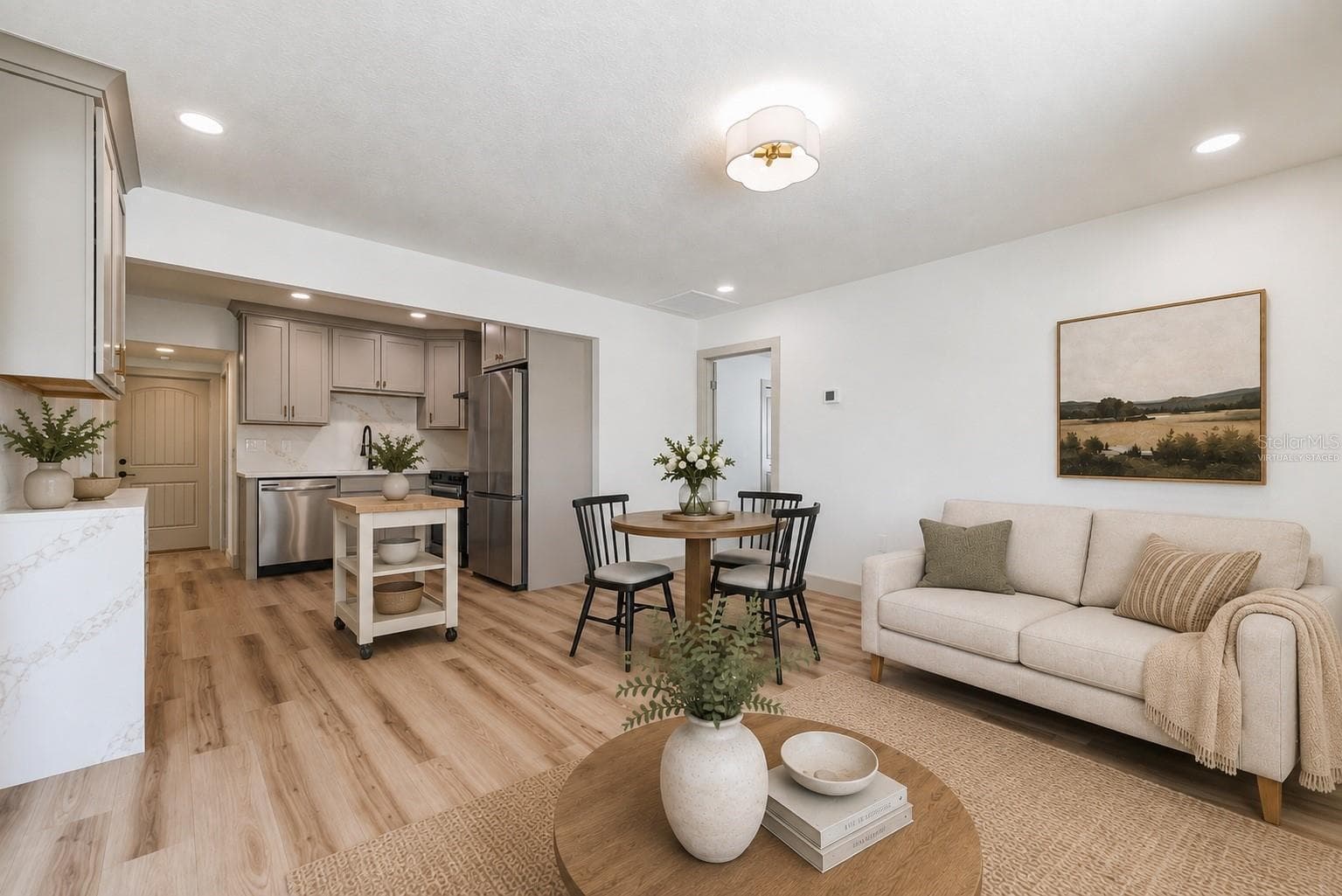 Virtually Staged. Great Room and Kitchen - 7851 40TH AVE N, ST PETERSBURG