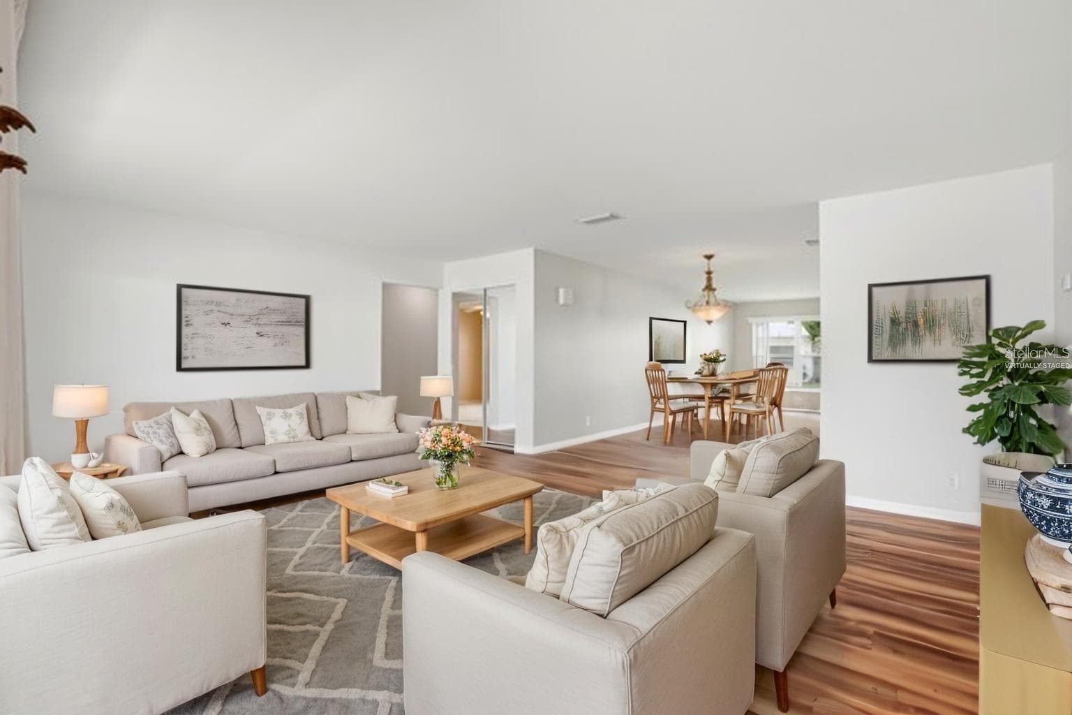 Another virtually staged living room photo. - 3939 90TH TER N, PINELLAS PARK