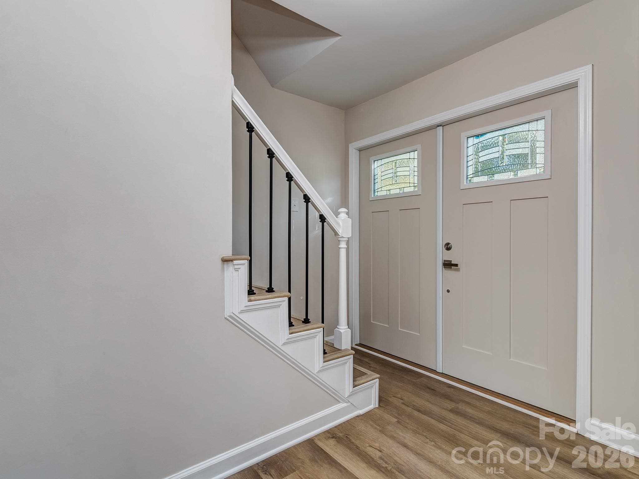 Foyer. When coming into the house your eye can see through the big case openings between the Dining Room, Living Room and the Kitchen. - 2041 Glouchester Circle, Charlotte