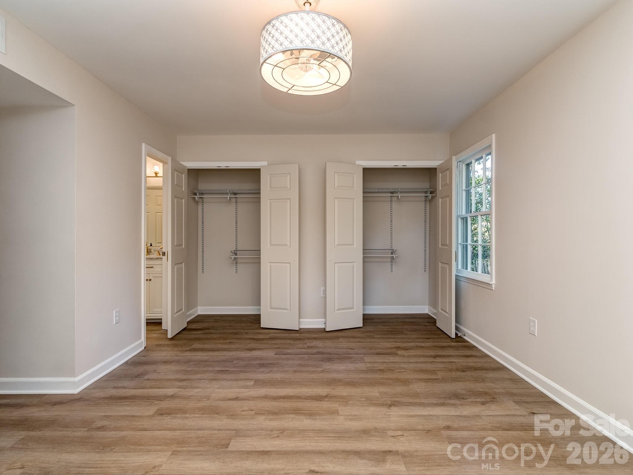 Primary bedroom closets are spacious and have organized shelving for all your clothes and accessories. - 2041 Glouchester Circle, Charlotte