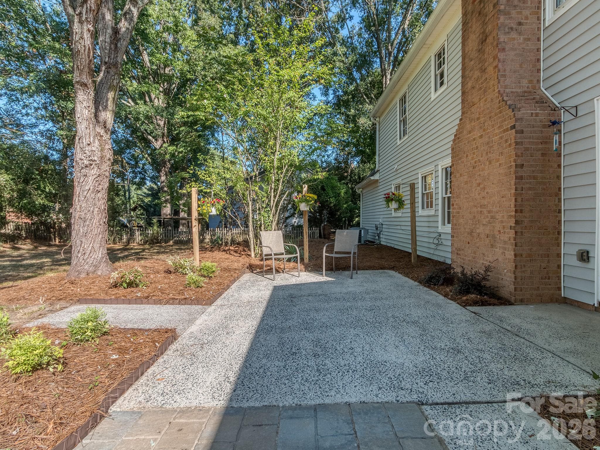Patio large enough for a table and chairs for 6 and extra seating. - 2041 Glouchester Circle, Charlotte