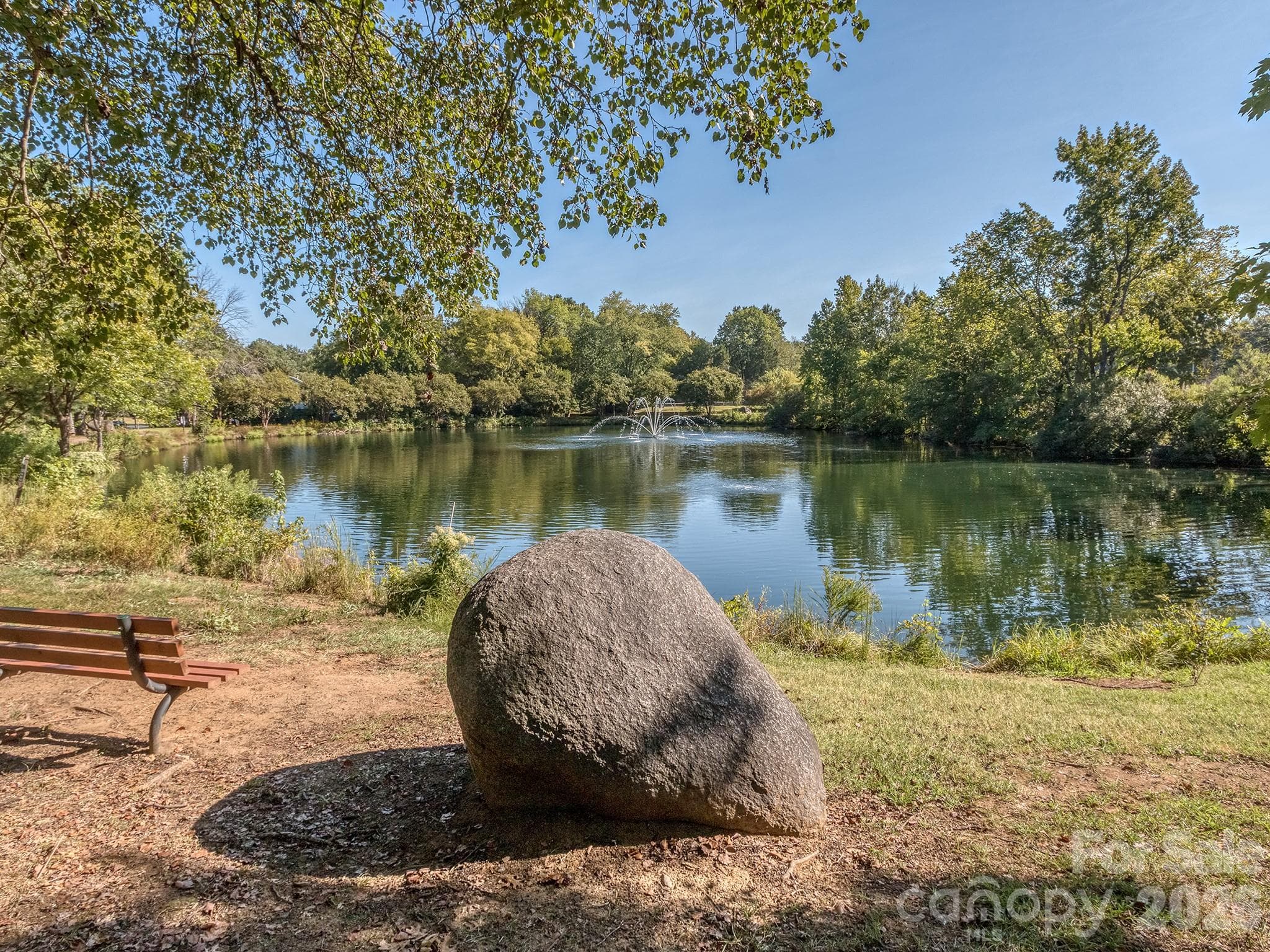 Beautiful big pond for fishing, relaxing or reading a book from one of the benches or the huge boulders around the water. Bring a chair and fall asleep to the sound of the splashing water from the fountain. - 2041 Glouchester Circle, Charlotte