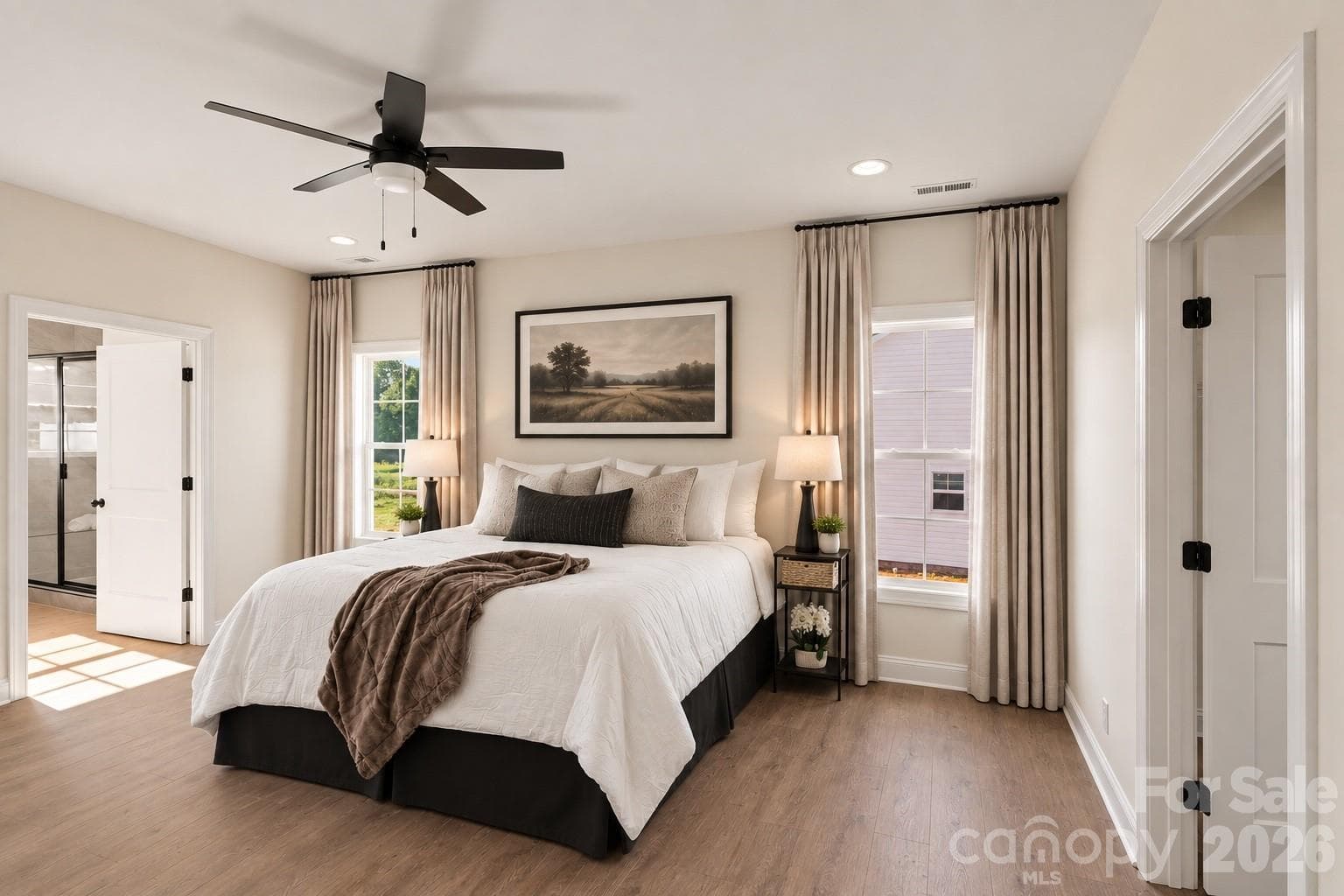 Primary bedroom has been physically staged only the curtains and photo above bed was added (virtually) - 155 Southern Oaks Lane, Salisbury