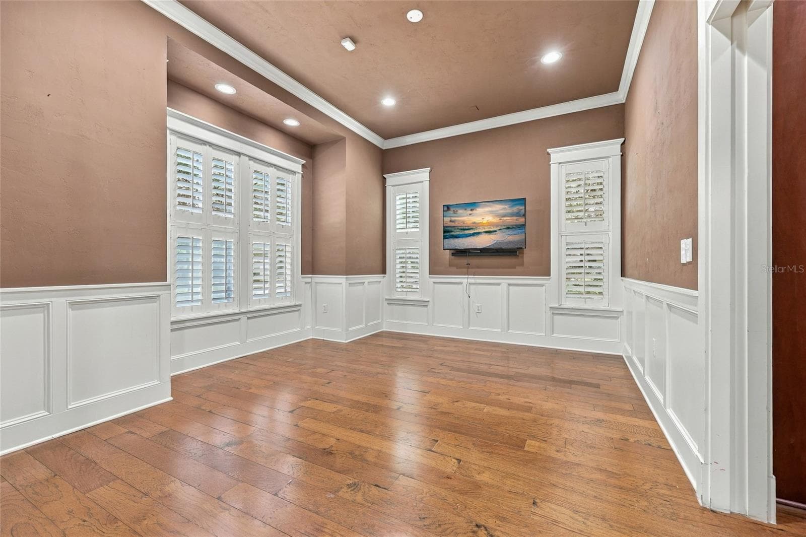 Formal Dining Room with plantation shutters &  custom crown moulding - 734 SW 134TH WAY, NEWBERRY
