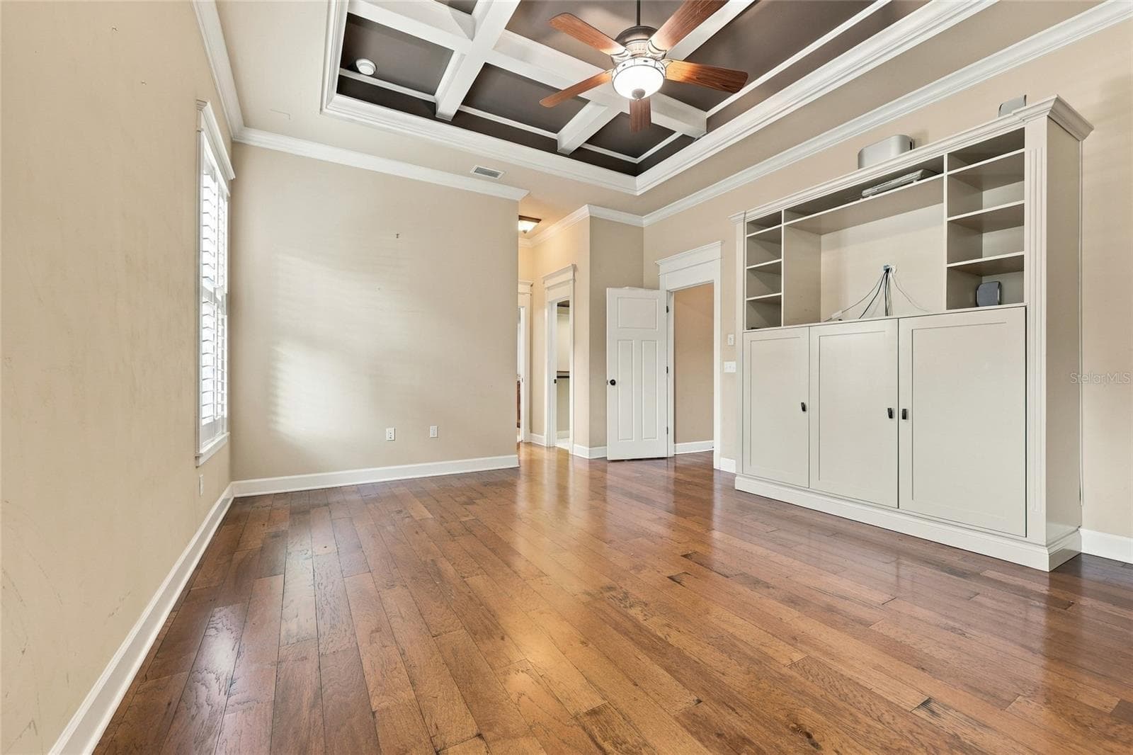 Primary Bedroom Suite with coffered ceiling and custom built-ins - 734 SW 134TH WAY, NEWBERRY