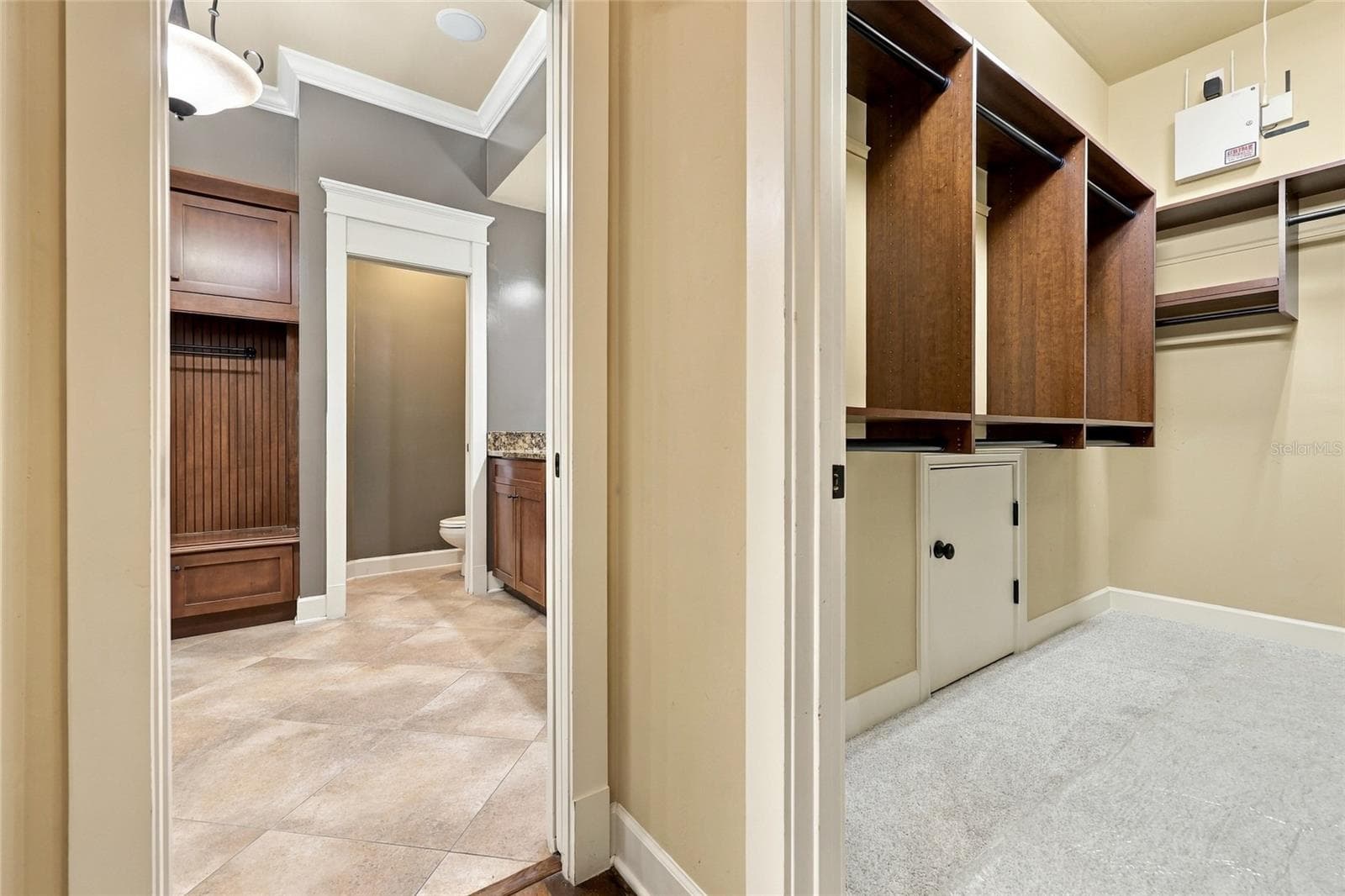His and Her walk-in closets in primary bedroom (downstairs) - 734 SW 134TH WAY, NEWBERRY