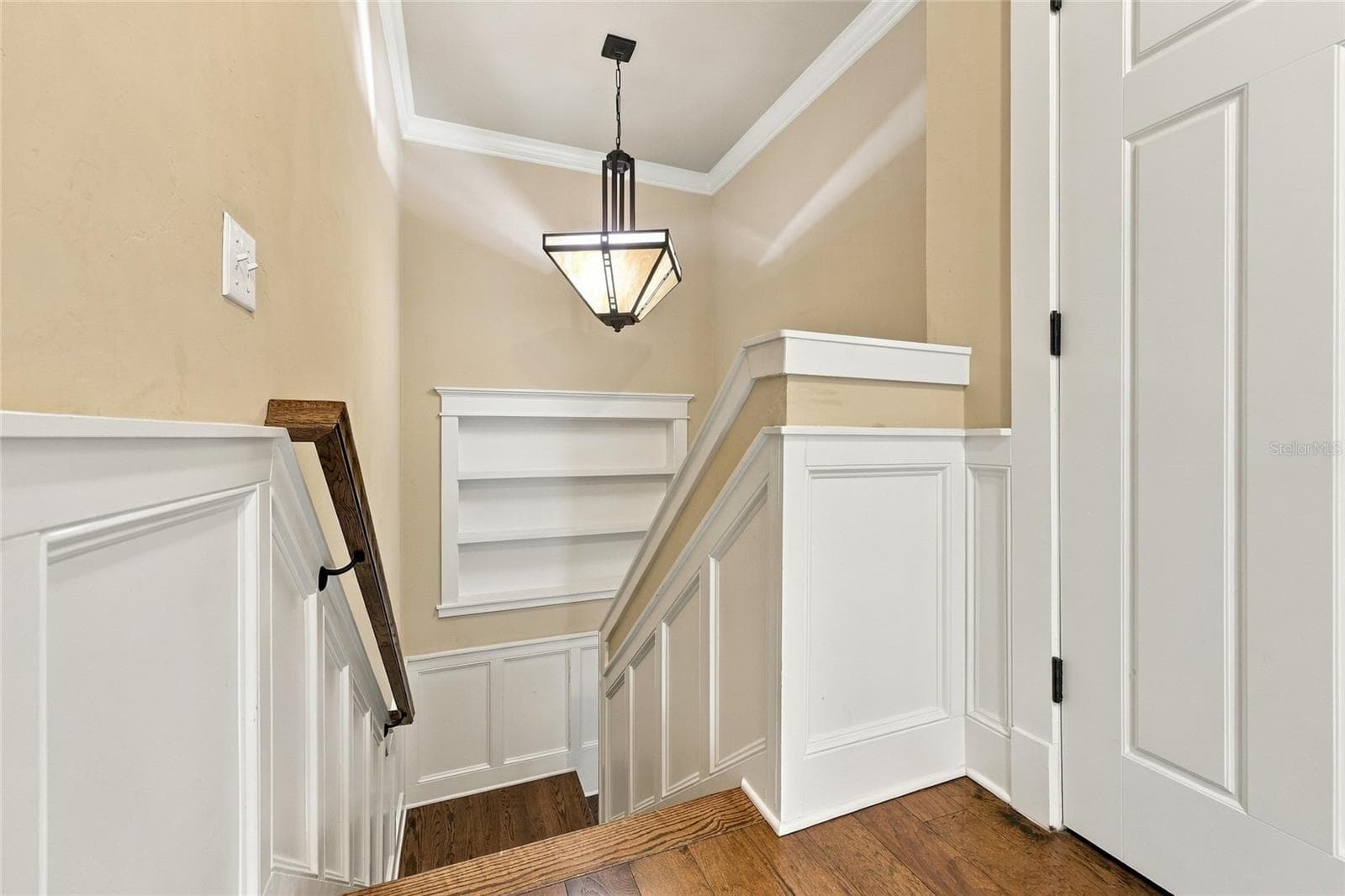 Landing to downstairs: custom paneling on stairs - 734 SW 134TH WAY, NEWBERRY